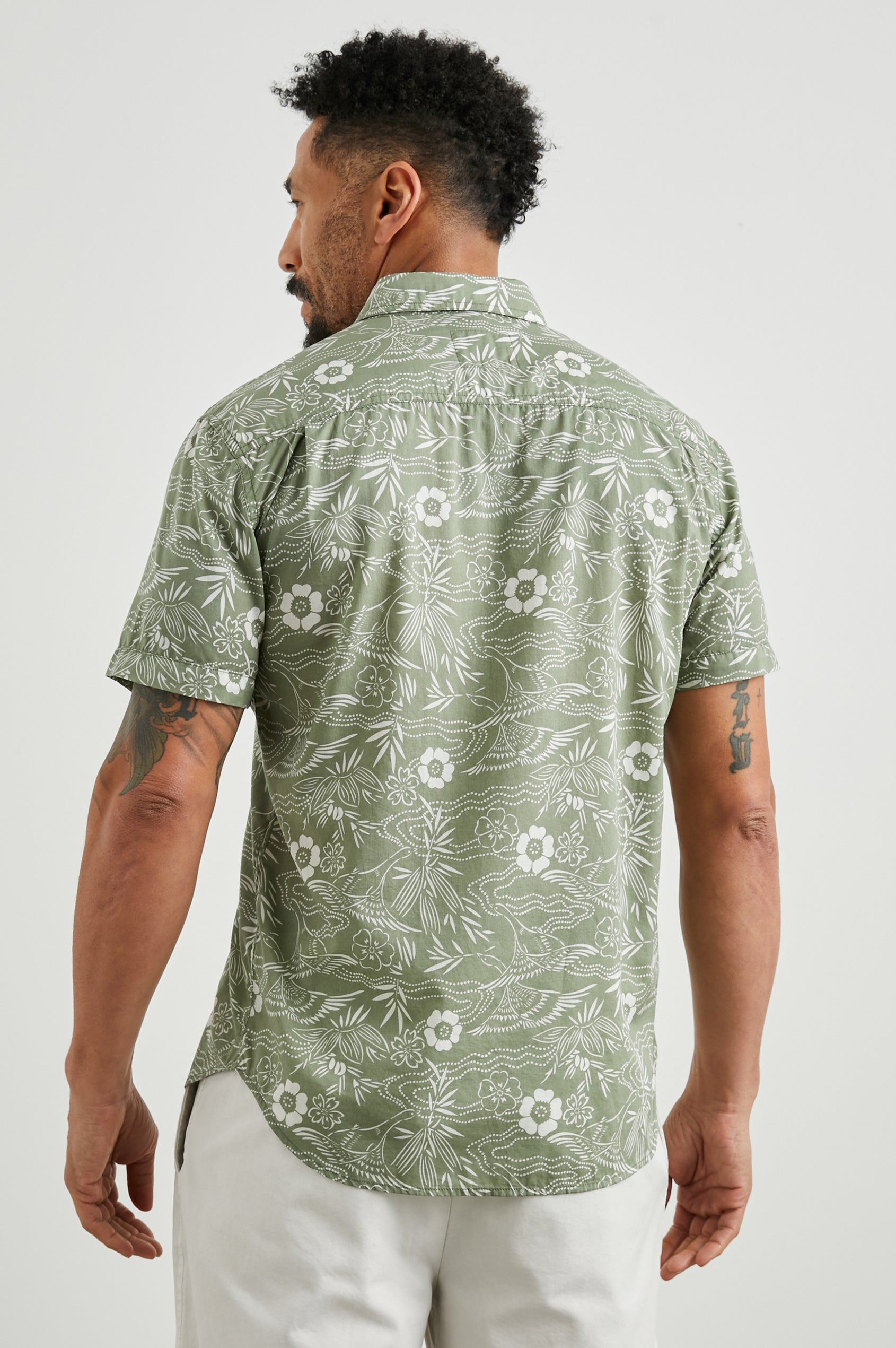 Monaco Short-Sleeve Button Up with a Chest Patch Pocket in Japanese Stencil Fatigue Colorway, a White Floral Print on Fatigue - Back View Featured on Model
