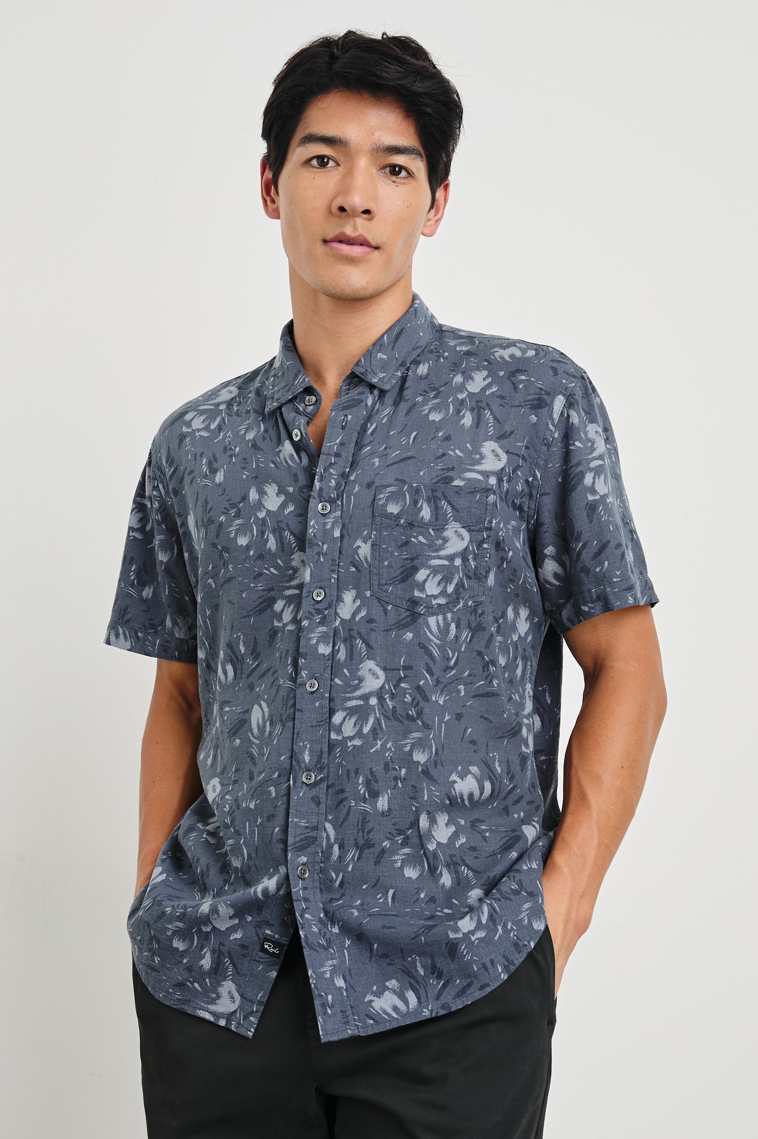 Monaco Short-Sleeve Button Up with a Chest Patch Pocket in Navy Floral Brush Colorway, Abstract Flowers in Blues on Navy - Front View Featured on Model