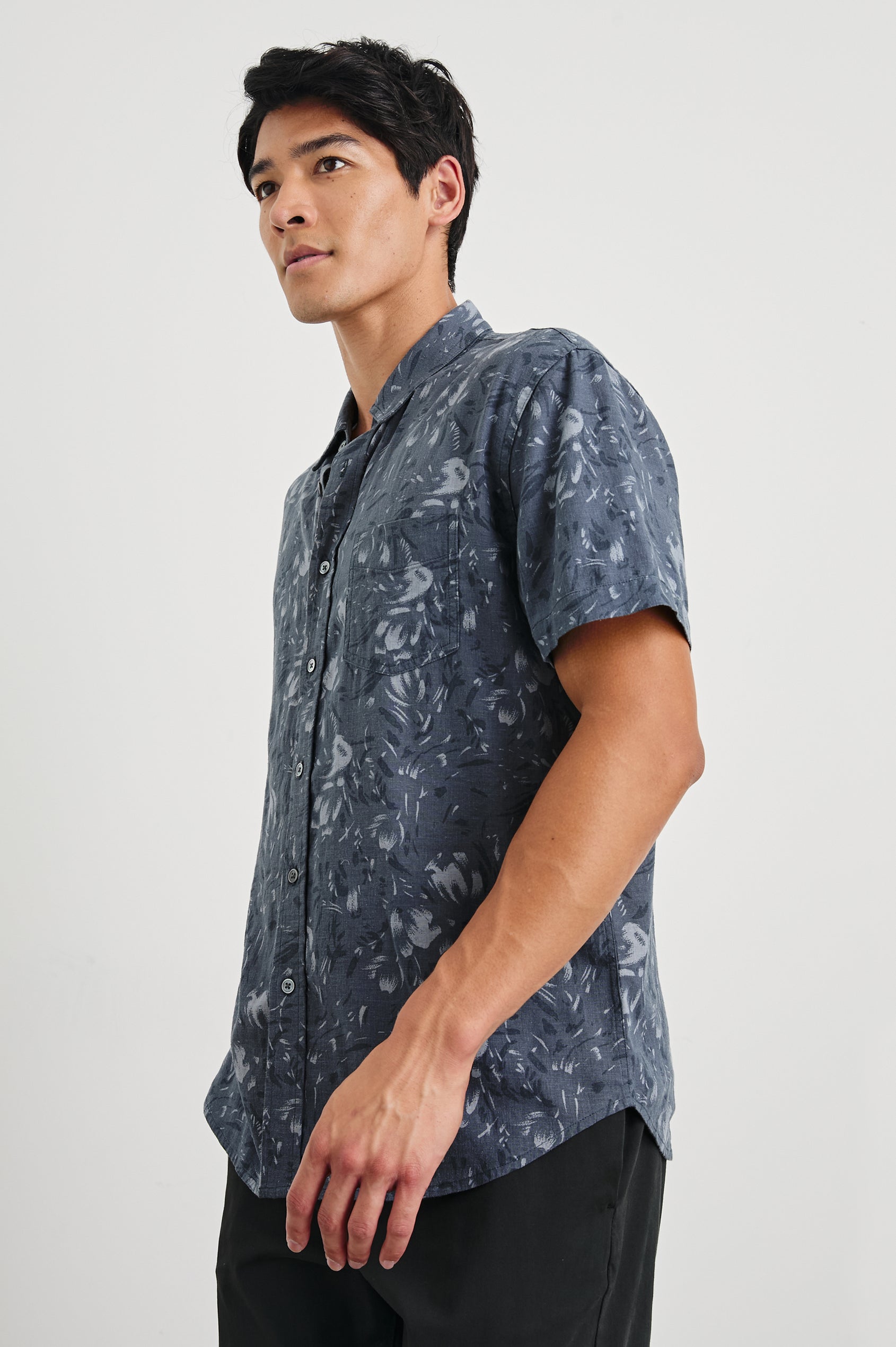 Monaco Short-Sleeve Button Up with a Chest Patch Pocket in Navy Floral Brush Colorway, Abstract Flowers in Blues on Navy - Side View Featured on Model