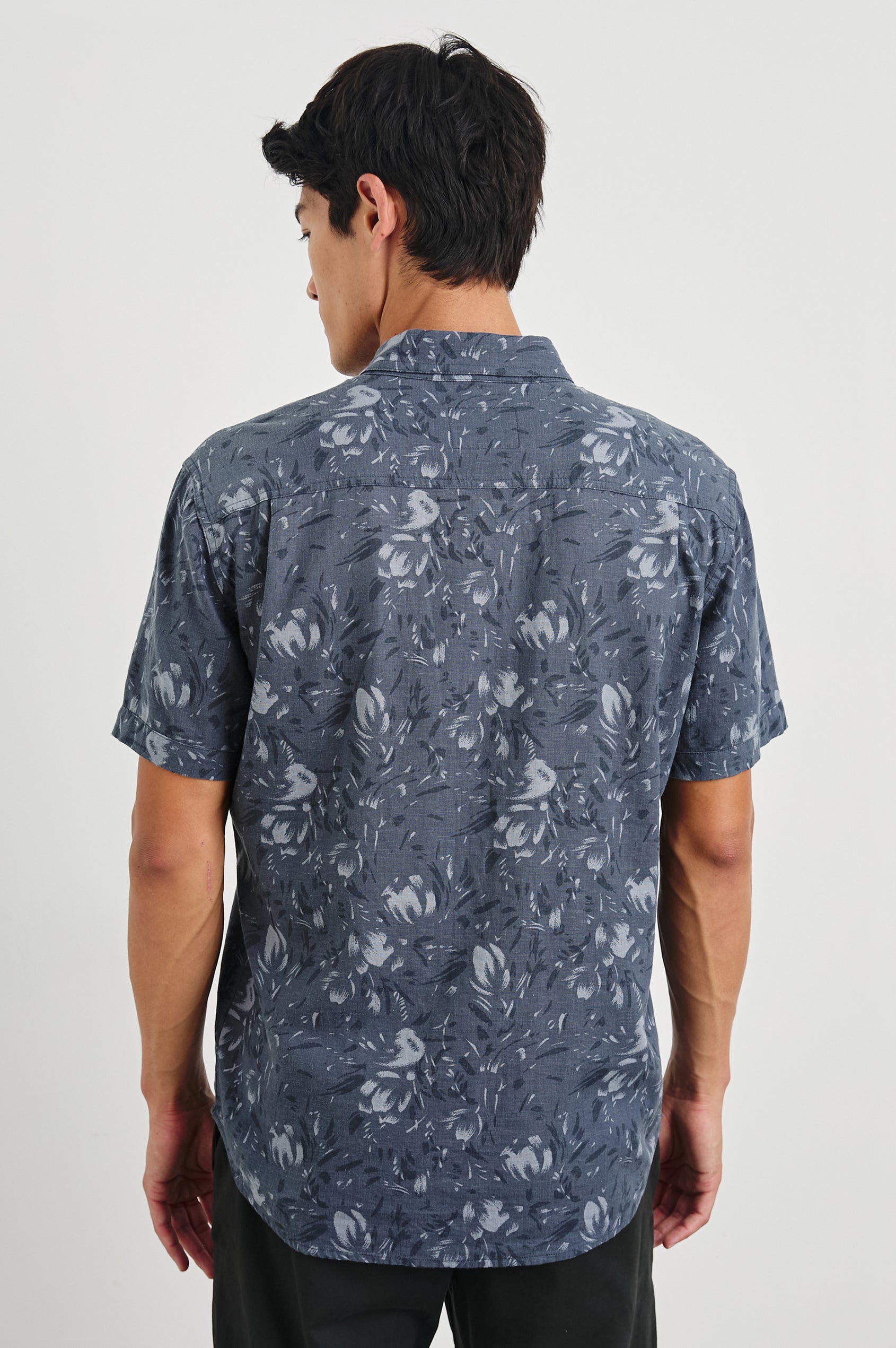 Monaco Short-Sleeve Button Up with a Chest Patch Pocket in Navy Floral Brush Colorway, Abstract Flowers in Blues on Navy - Back View Featured on Model