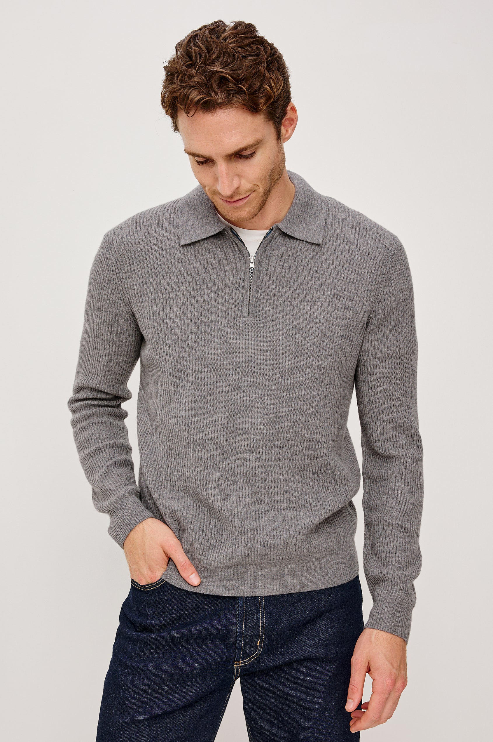 Monty is a collared quarter-zip long sleeved sweater in Finch colorway. Front view featured on the model.