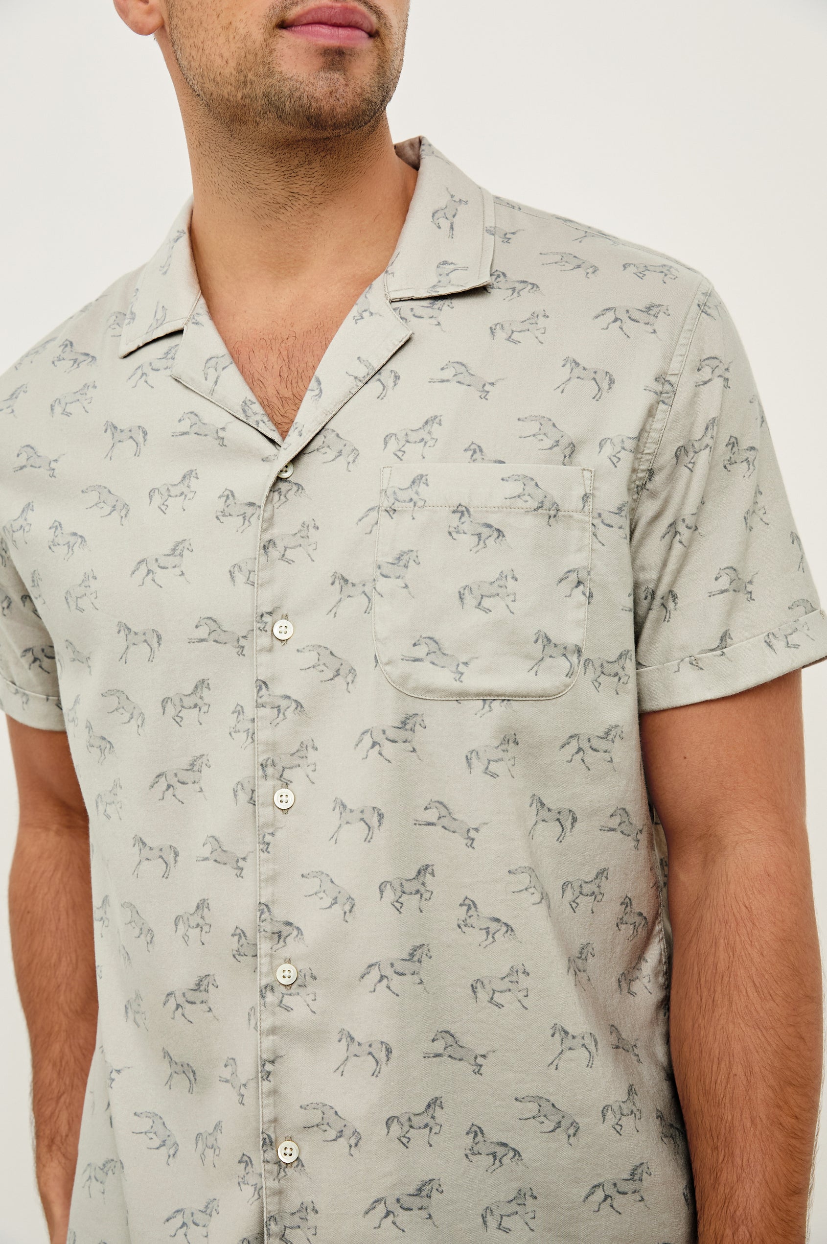 Moreno short sleeve button up shirt with camp collar and chest pocket in Stallion Parchment Indigo pattern - close up of details on model