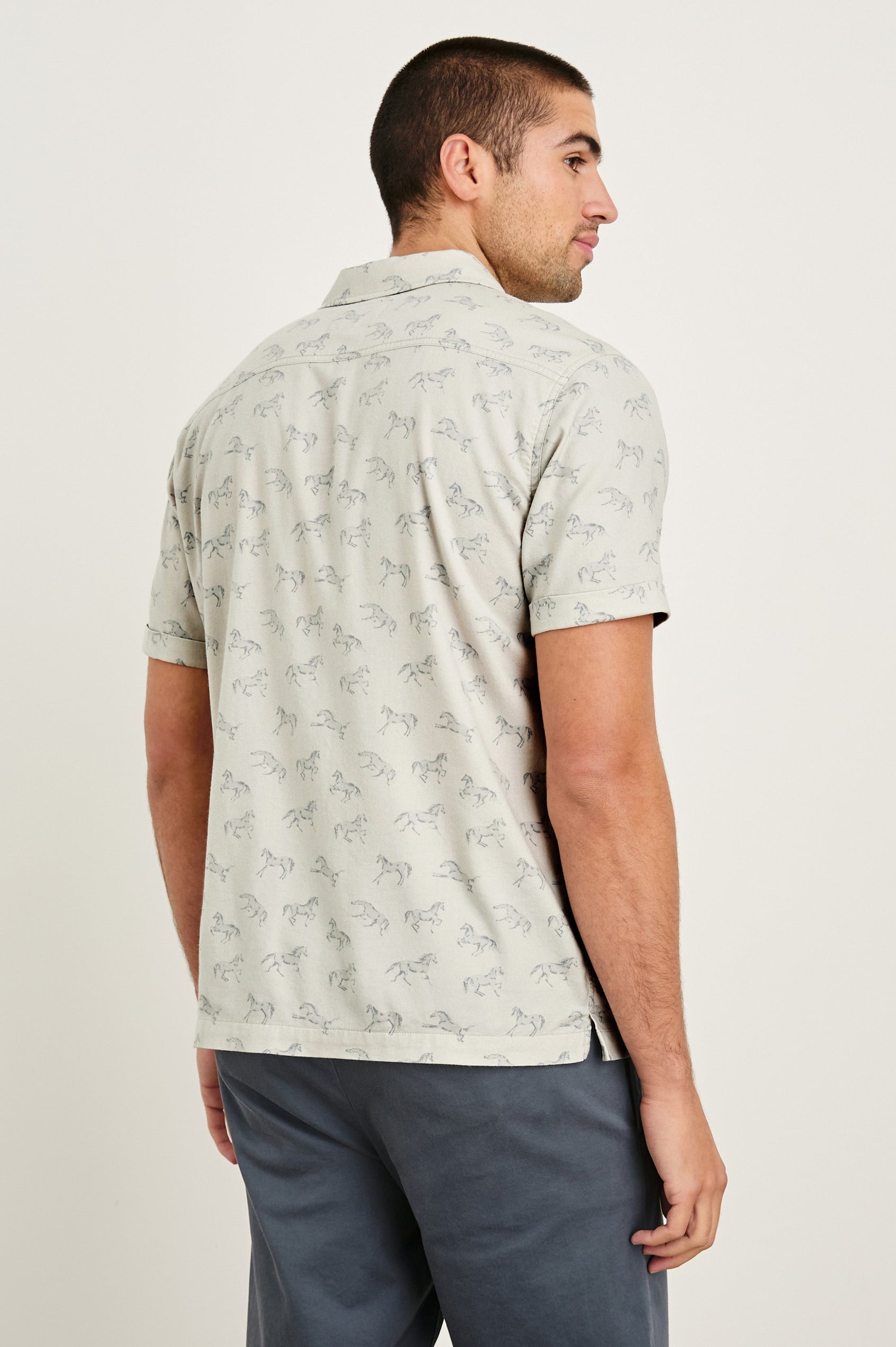 Moreno short sleeve button up shirt with camp collar and chest pocket in Stallion Parchment Indigo pattern - back view on model