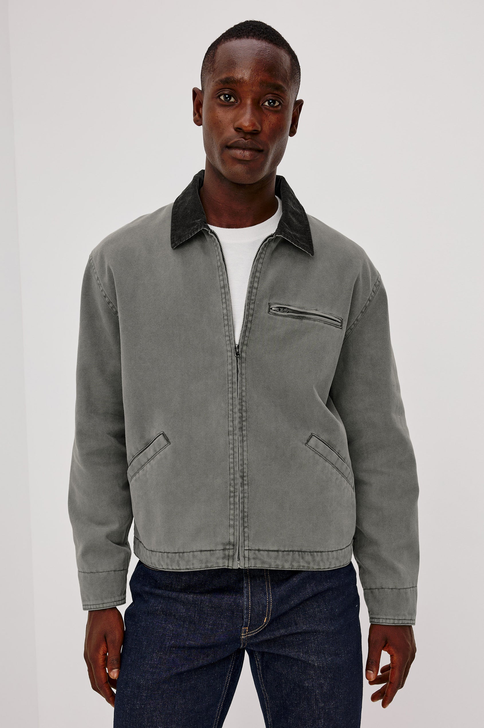 Morro Workwear Utility Jacket in Heavy Cotton Canvas Duck With Corduroy Collar, Chest Zip Pocket, Side Welt Pockets, and Custom Dobby Lining in Graphite Colorway - Upper Body Front View Featured on Model