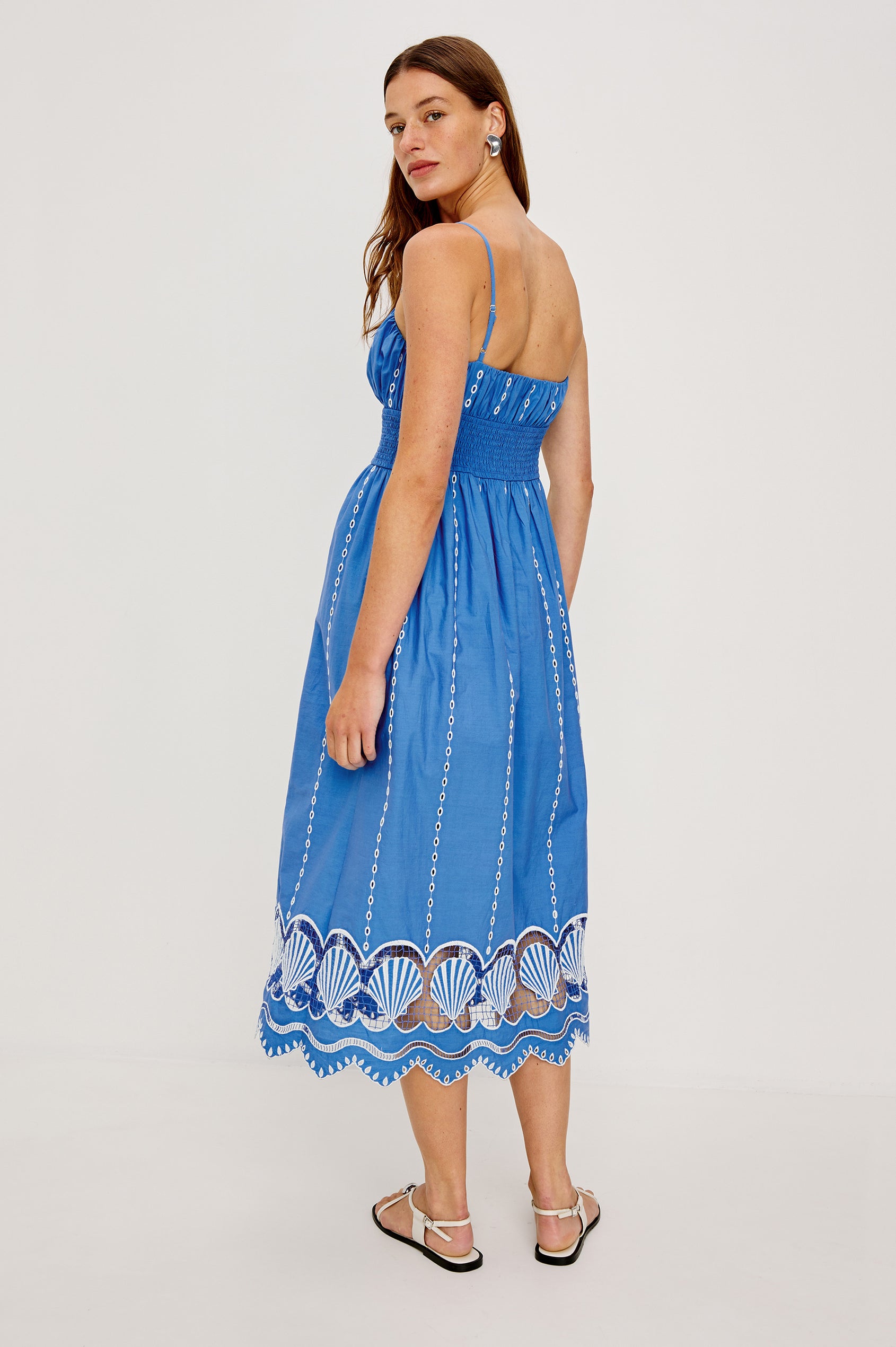 Murano Midi Tank Dress with Spaghetti Straps, Gathered Elastic Waistband, Sea Shell Embroidery and Scalloped Hem in French Blue Colorway. Full Body Back View Shown on Model.
