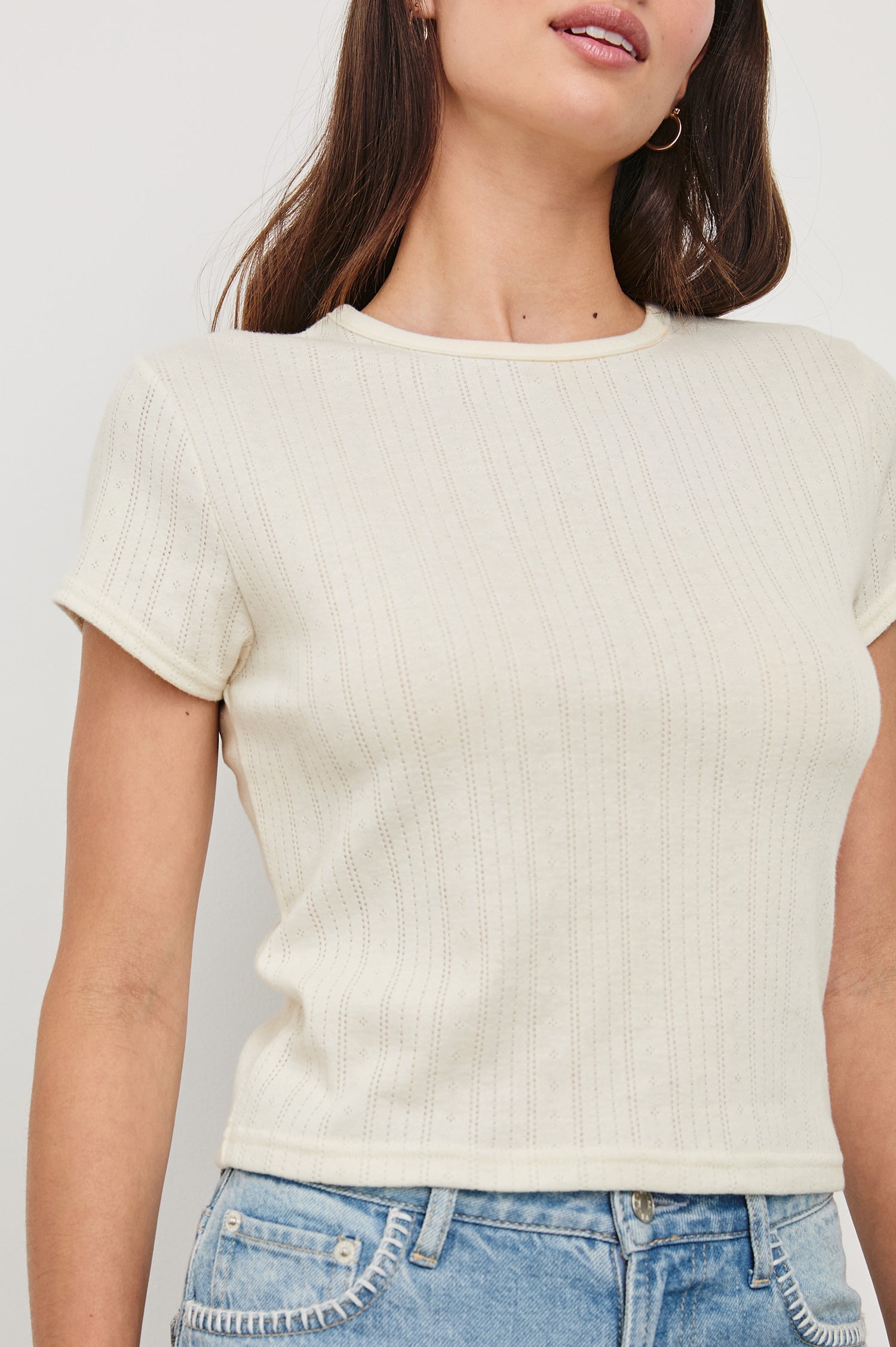 Muse crewneck short sleeve shirt with pointelle ribbed fabric in Ivory colorway - close up of details on model