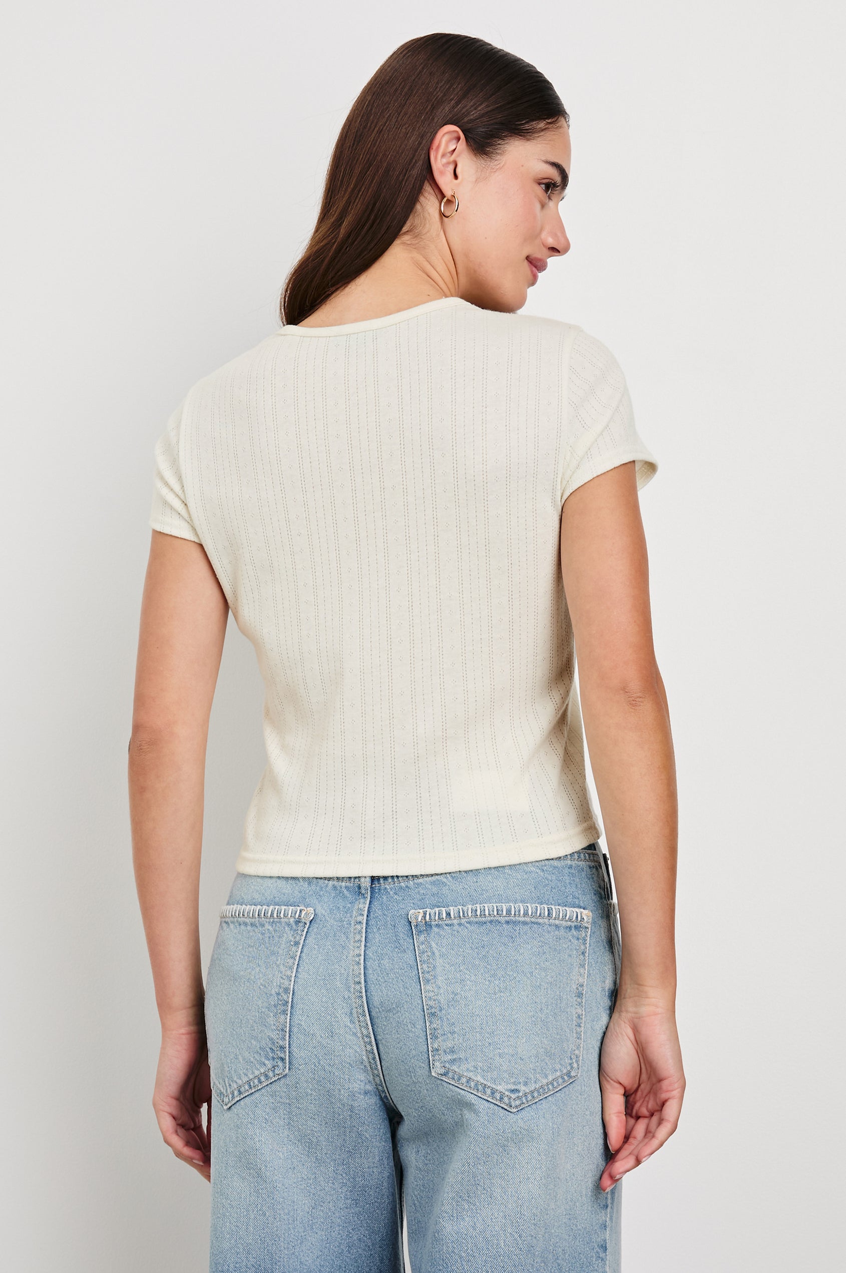 Muse crewneck short sleeve shirt with pointelle ribbed fabric in Ivory colorway - back view on model