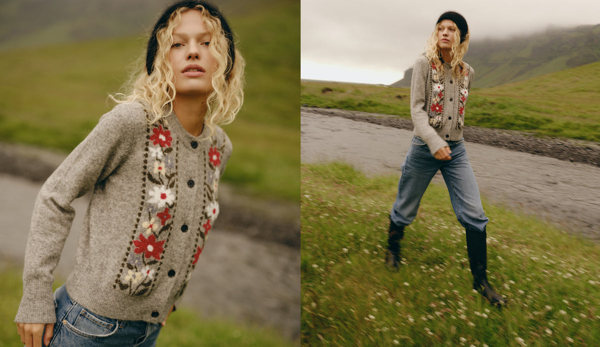 A split-screen lifestyle image showing a model wearing a gray knit cardigan with red and white floral embroidery, paired with blue jeans and black boots, in an outdoor grassy landscape.