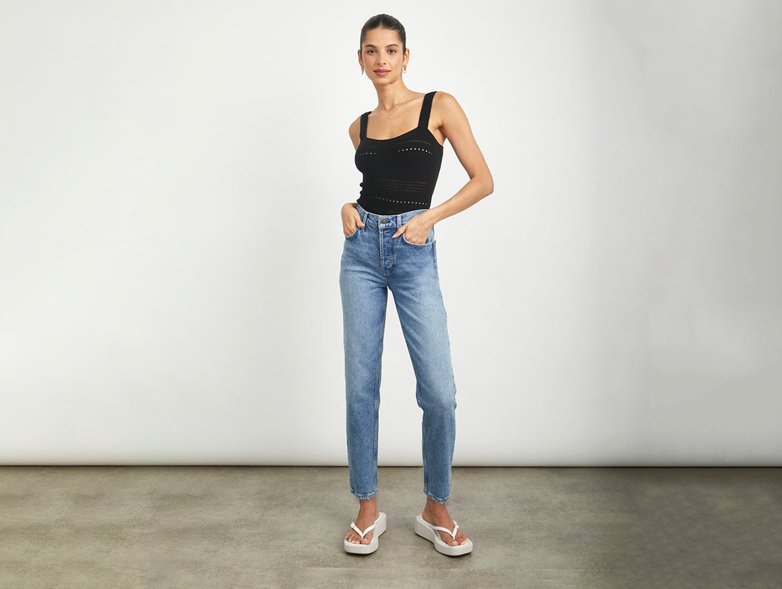 FRONT FULL BODY SHOT OF MODEL WEARING THE MELROSE SLIM JEAN WITH A BLACK TANK TOP