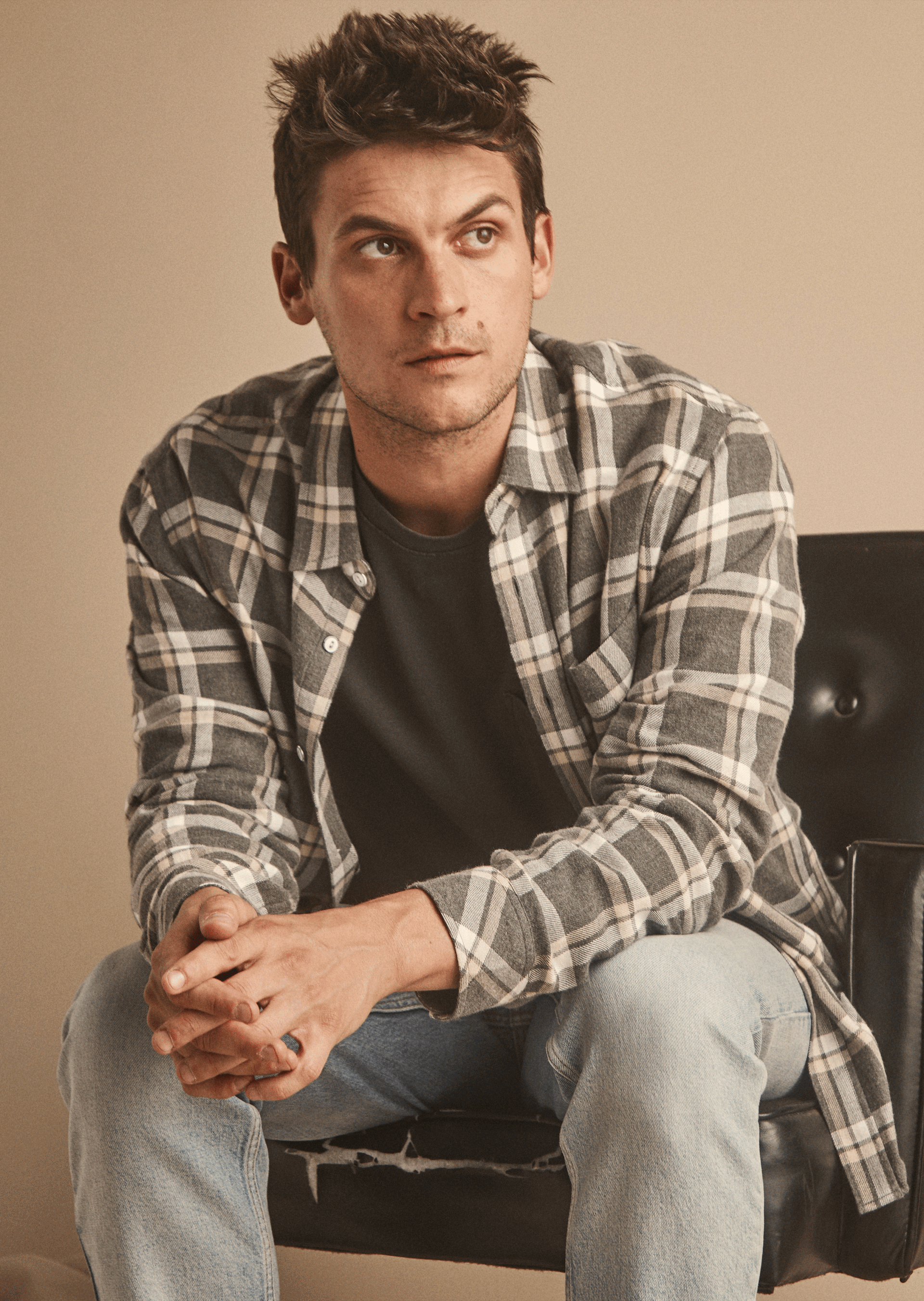 EDITORIAL IMAGE OF MODEL WEARING LENNOX SHIRT IN CHARCOAL GHURKA MELANGE AND JOHNNY T-SHIRT IN CARBON