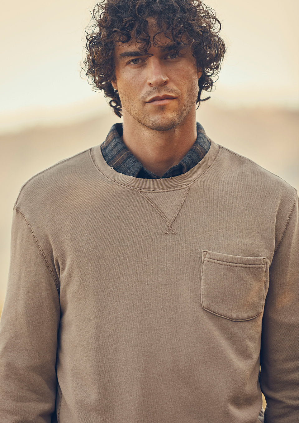 DETAIL IMAGE OF MODEL WEARING SWEATER