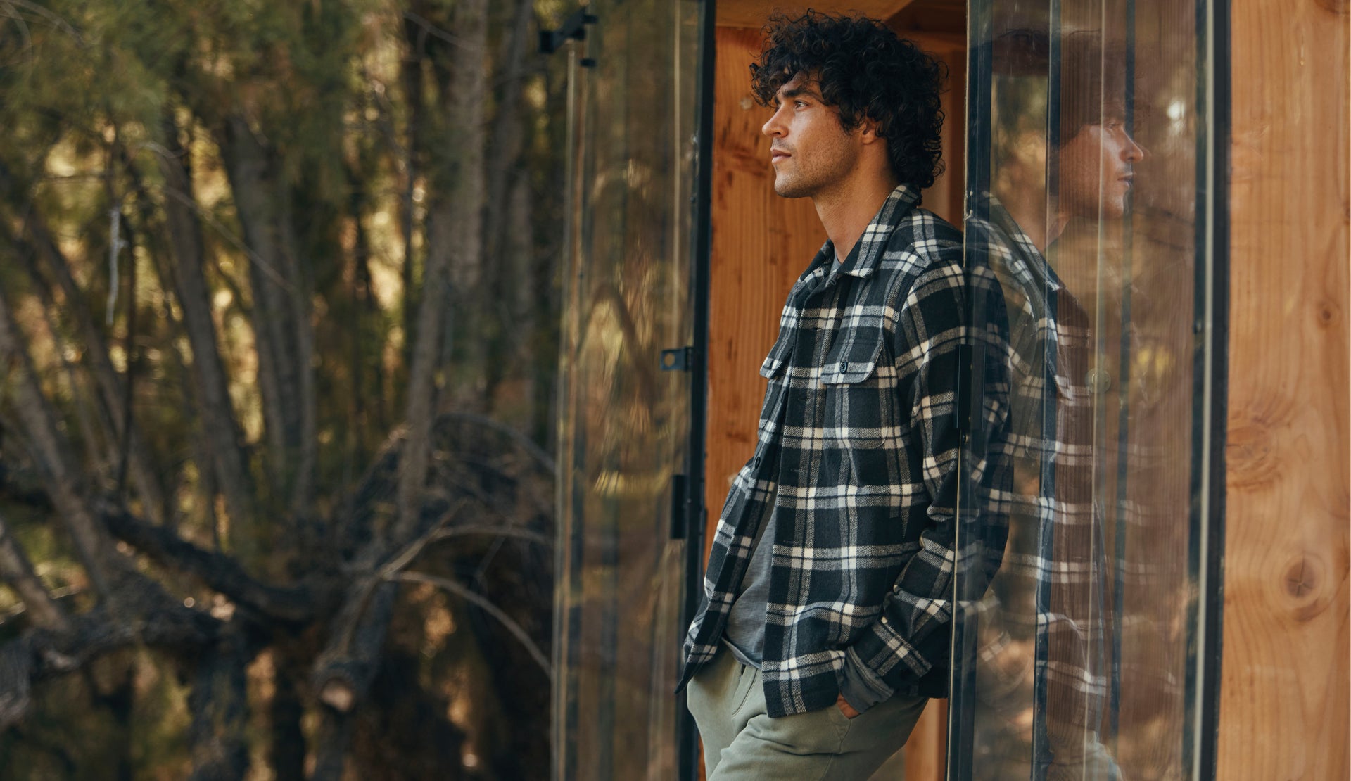 SIDE EDITORIAL IMAGE OF MODEL WEARING VIGGO SHIRT JACKET AND TRENT SWEATPANT