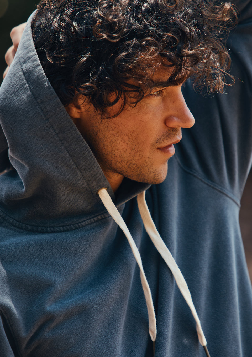 DETAIL SHOT OF MODEL WEARING APOLLO HOODIE