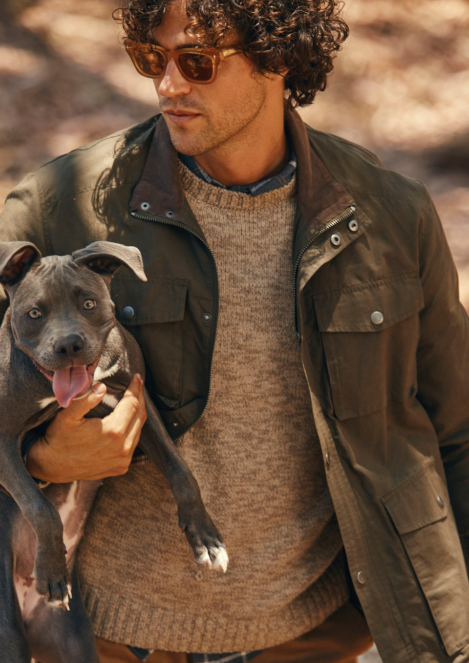 DETAIL EDITORIAL IMAGE OF MODEL WEARING CARDIFF JACKET AND ORRIN SWEATER