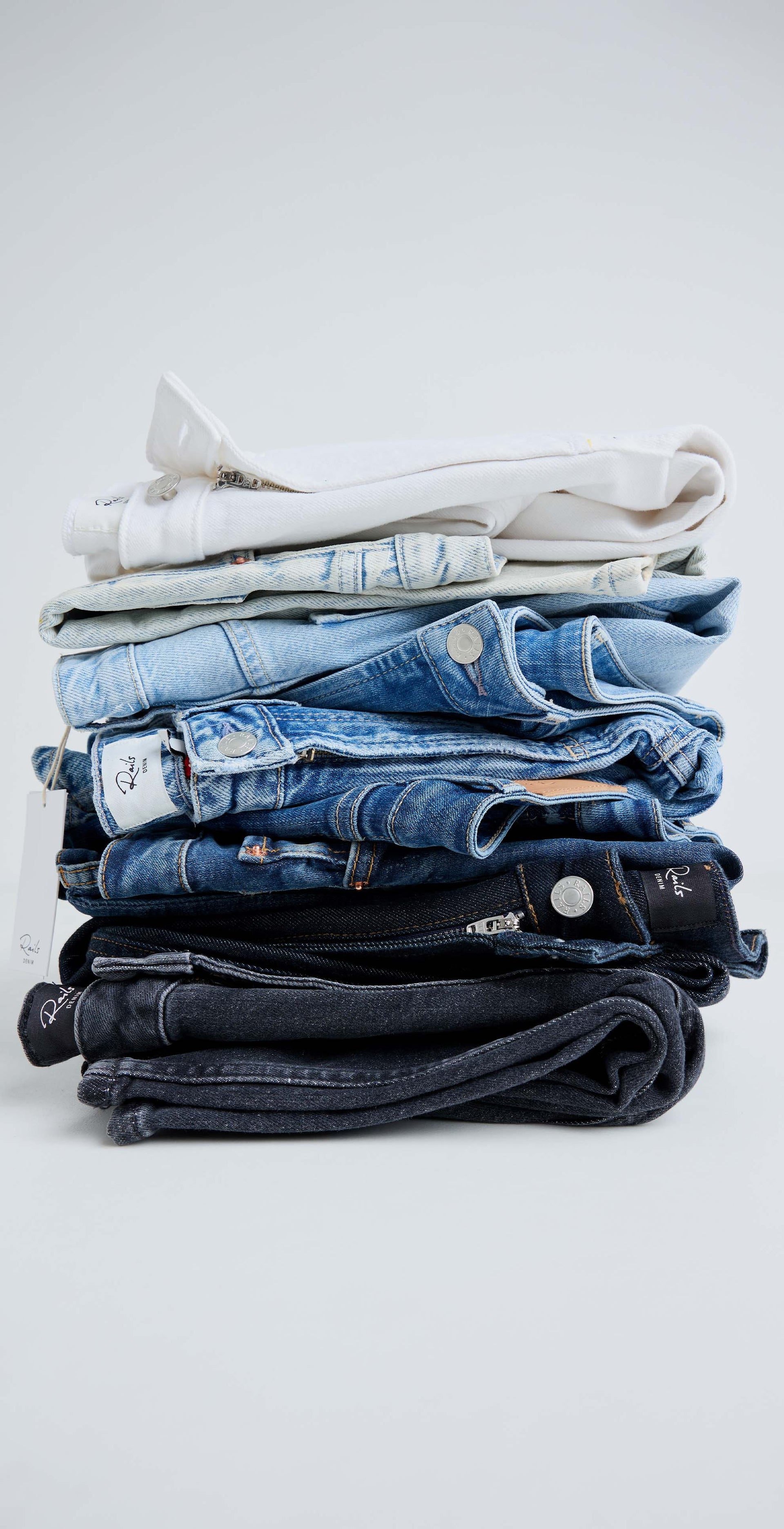 stacked variations of different color denim