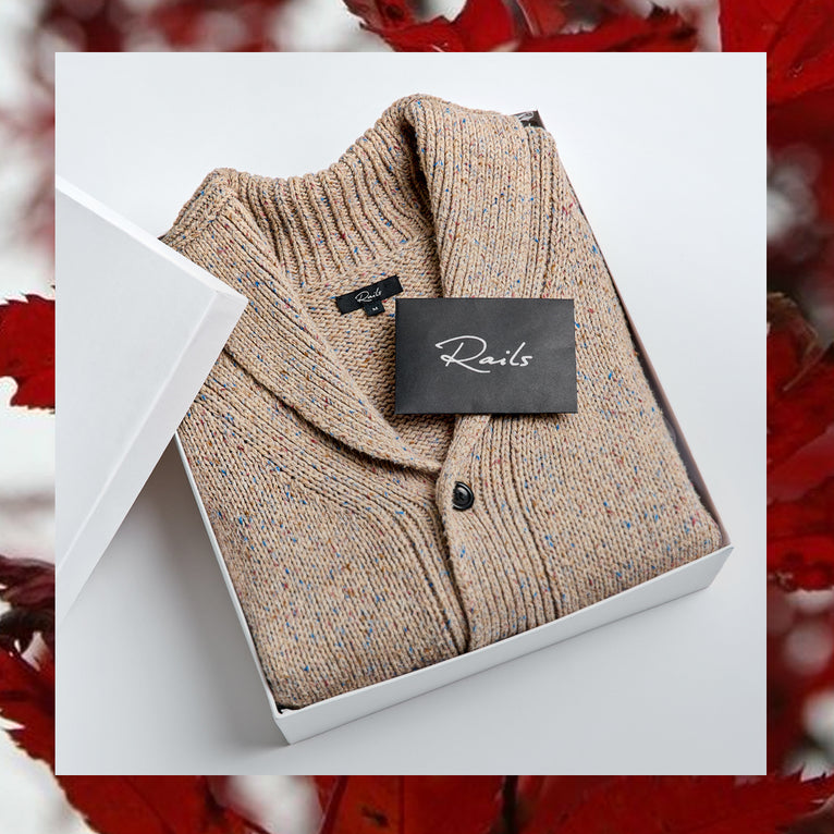 EDITORIAL IMAGE OF CORDEN CARDIGAN FOLDED IN A GIFT BOX