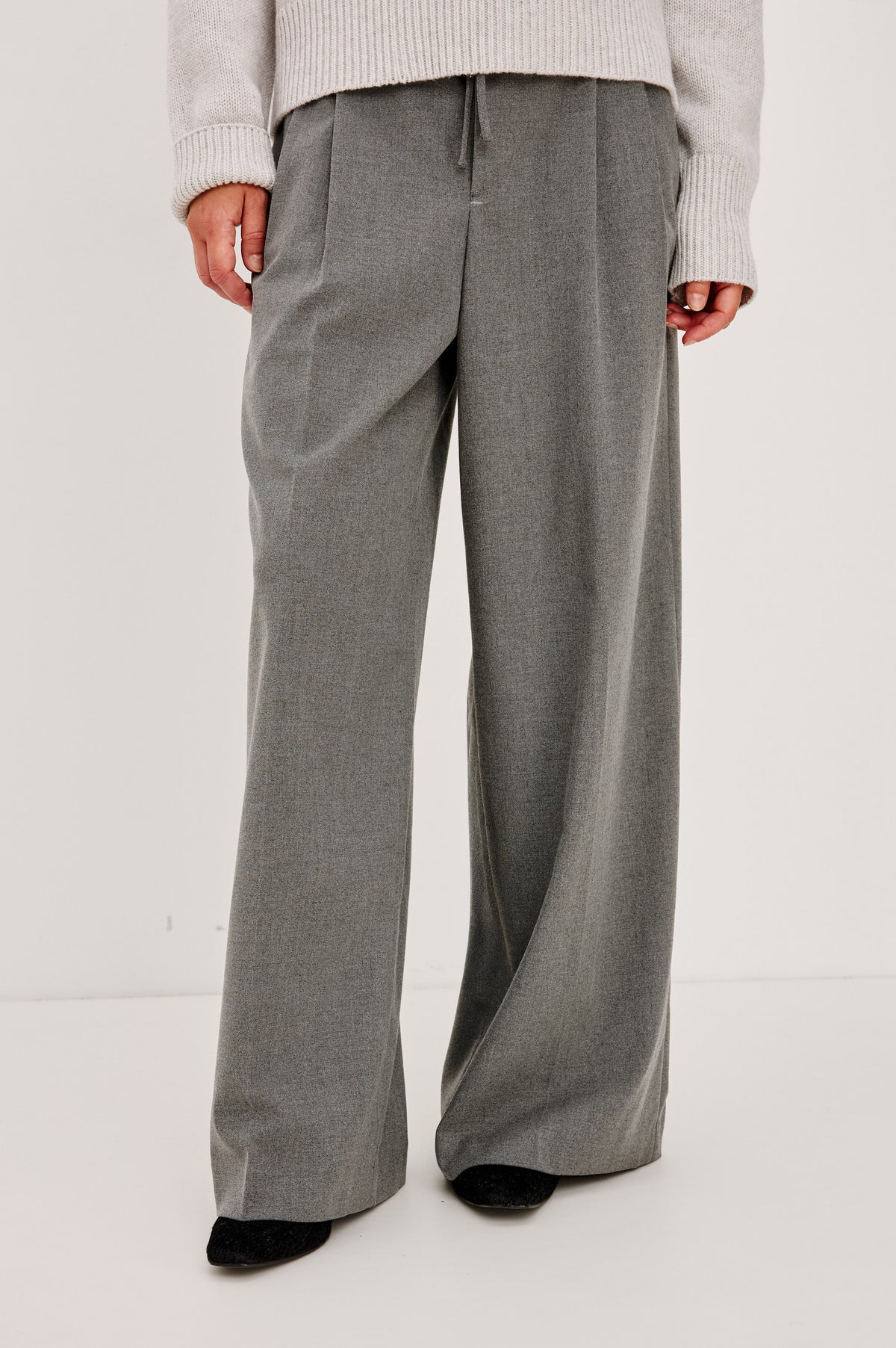 Nando Pant in Drapey Suiting Blend With High Waist, Wide, Relaxed Legs, and Drawstring Ties in Heather Charcoal Colorway - Front Crop View Feature on Model.