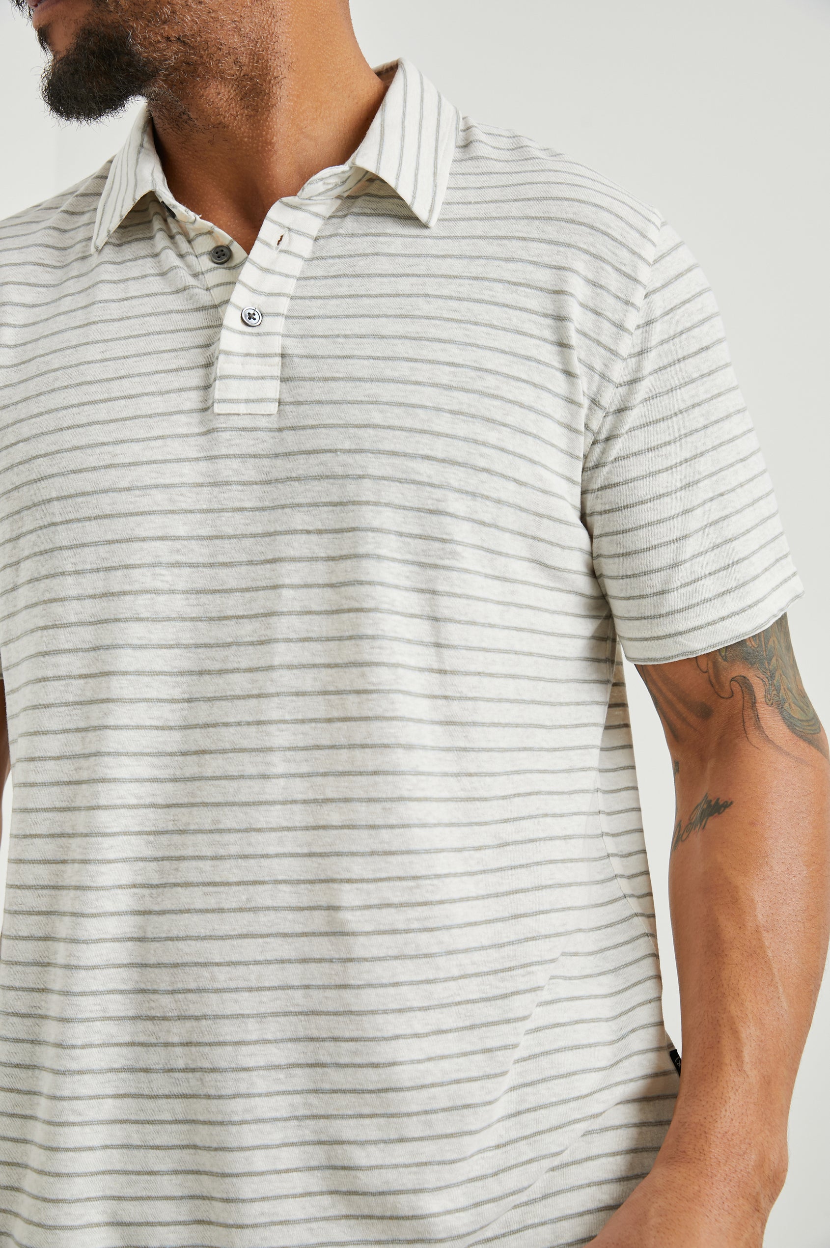 Napoli Short Sleeve Polo Shirt with a Three-Button Placket in Cream Barley Stripe Colorway, Horizontal Stripes - Front View Featured on Model