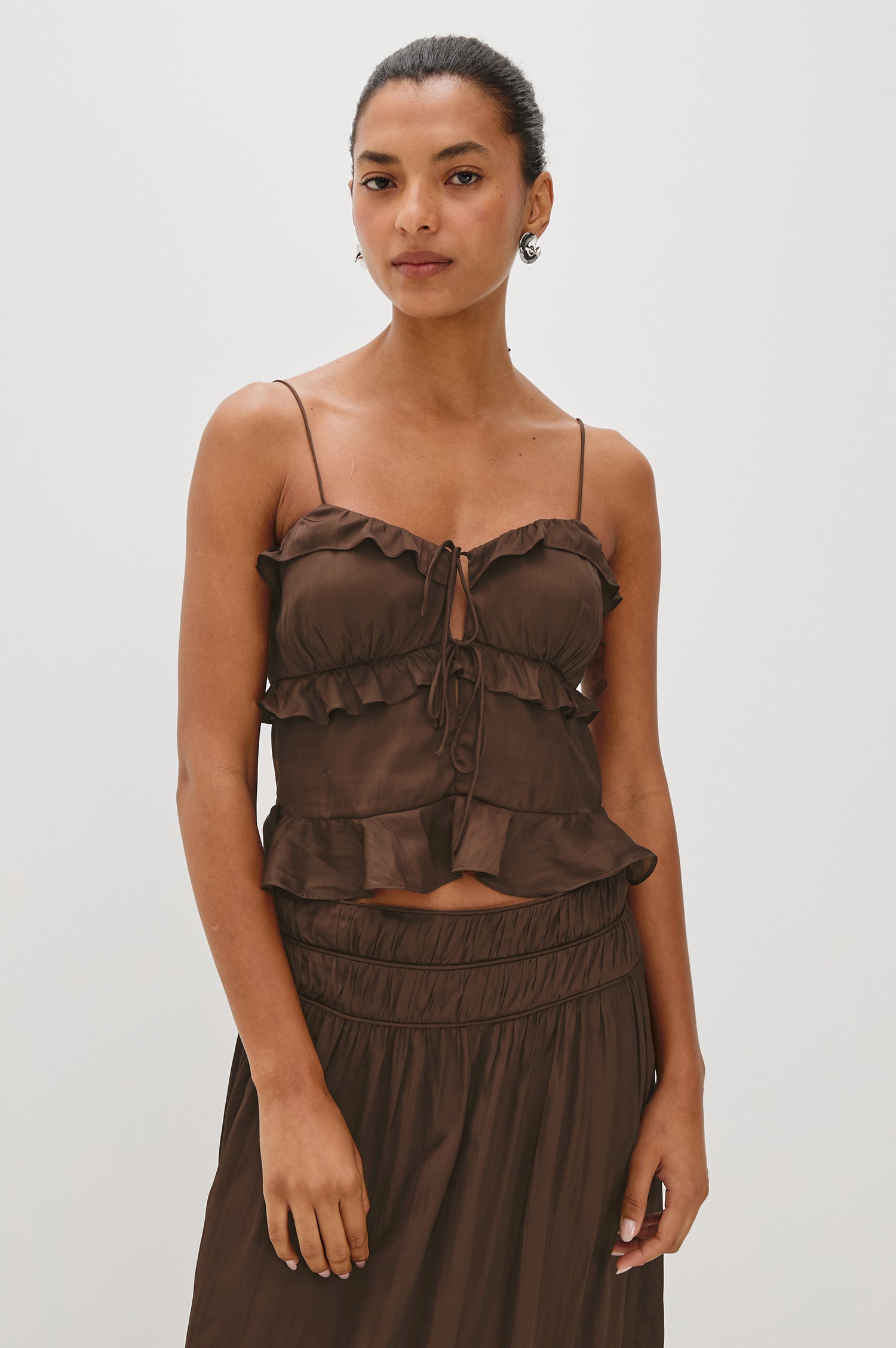 Ortona ruffled camisole with thin spaghetti straps and a tie-front detail - front view featured on model.