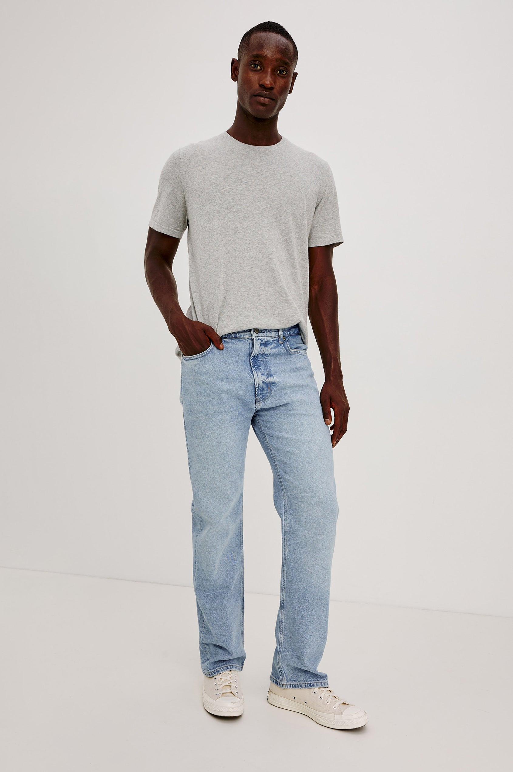 Nash is a straight leg 5-Pocket denim jean a zip fly and button closure as well as rivets in a Ranchwater Wash. Front view featured on model.