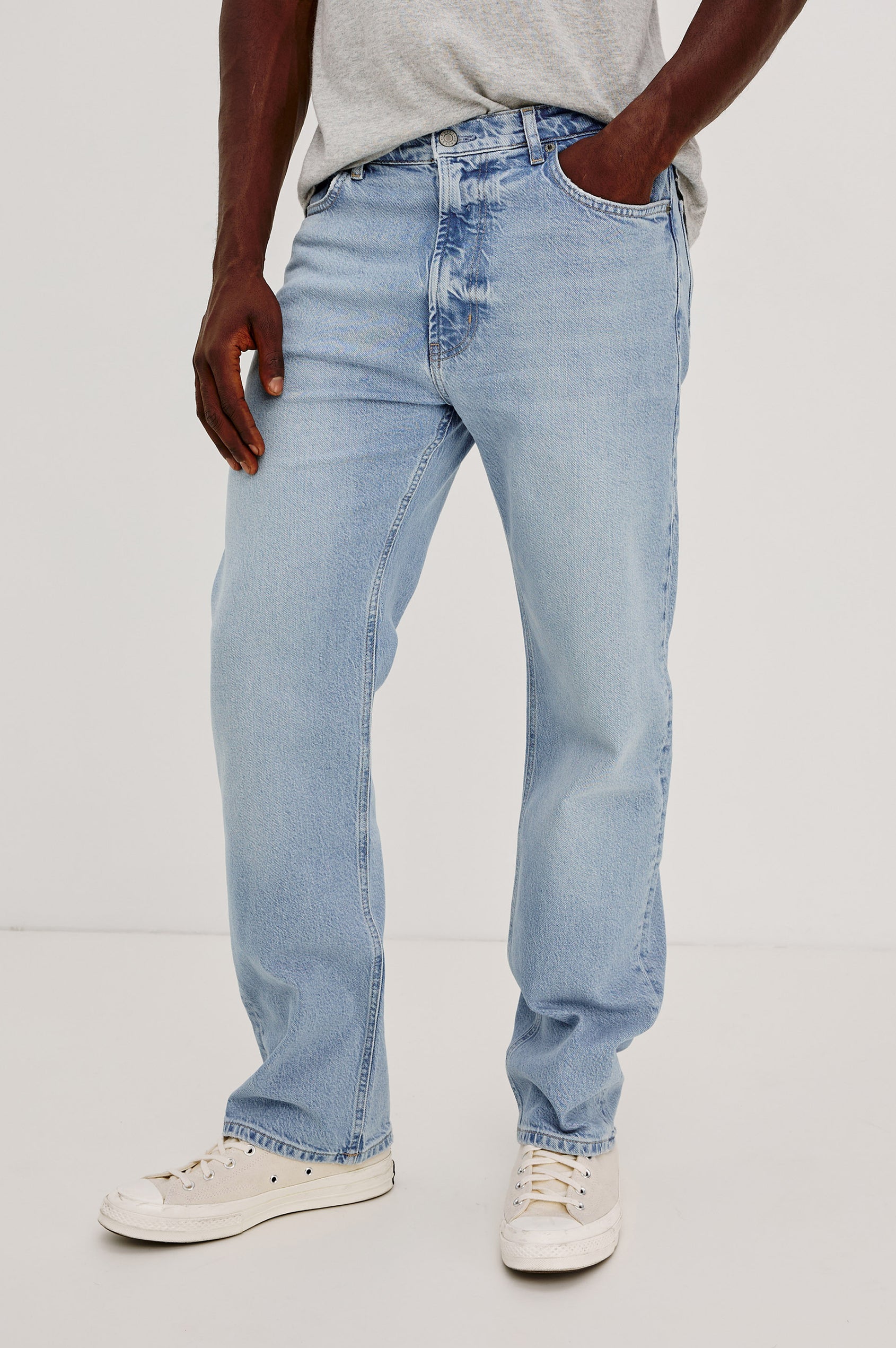 Nash is a straight leg 5-Pocket denim jean a zip fly and button closure as well as rivets in a Ranchwater Wash. Backview featured on model.