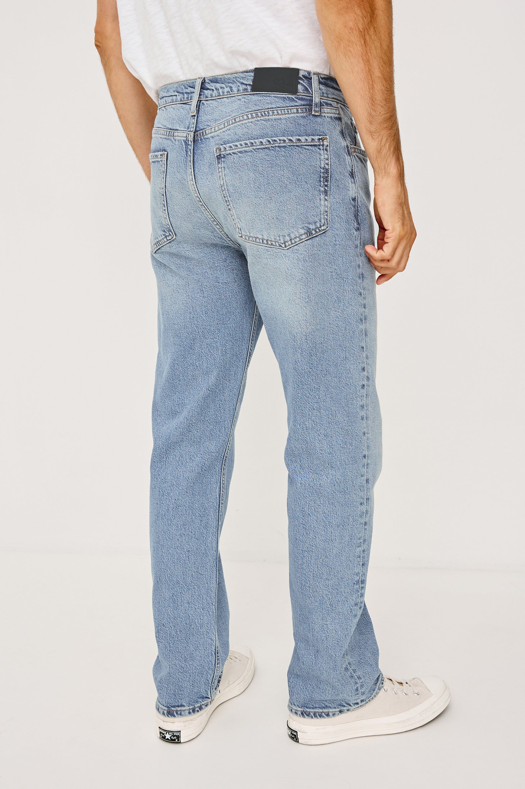 Nash is a straight leg 5-Pocket denim jean a zip fly and button closure as well as rivets in a Ranchwater Wash. Backview featured on model.