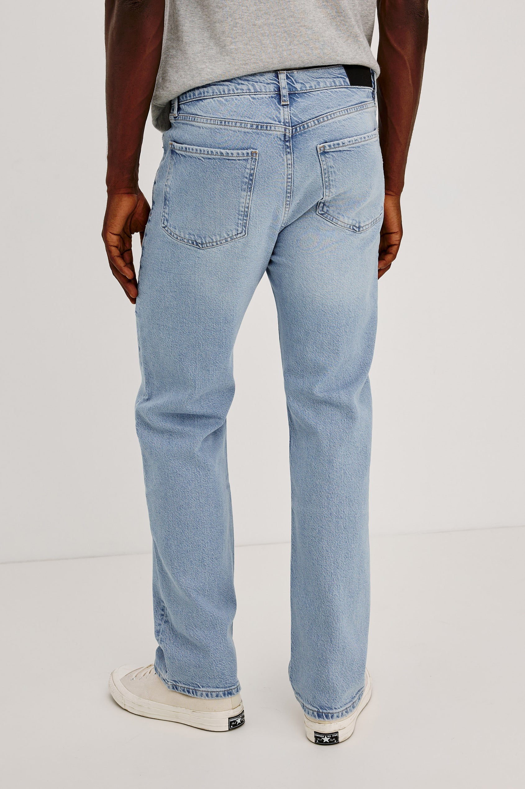 Nash is a straight leg 5-Pocket denim jean a zip fly and button closure as well as rivets in a Ranchwater Wash. Backview featured on model.