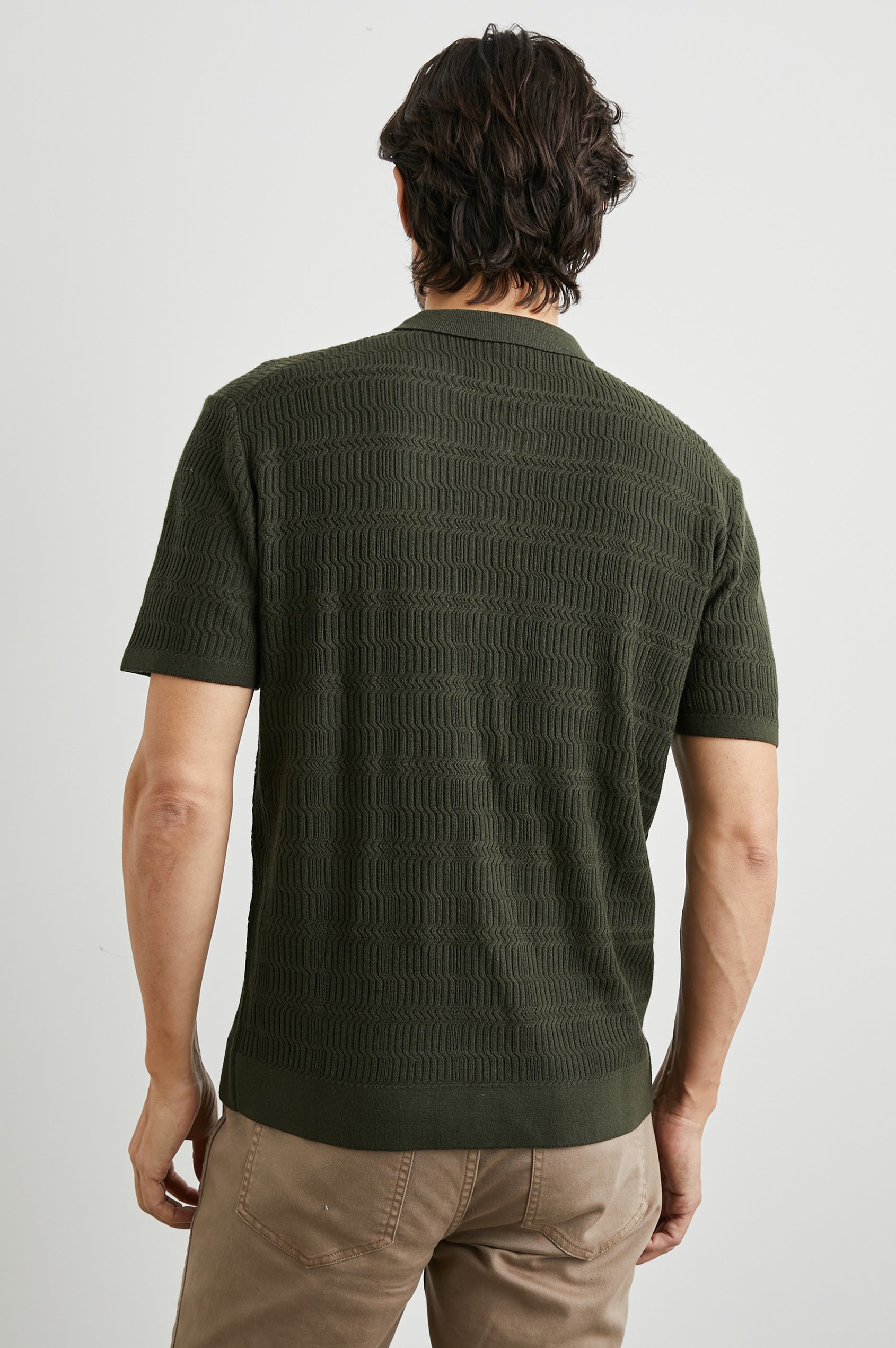 Nathan Short-Sleeve Polo Shirt with a Three-Button Placket and a Jacquard Pattern in Ancient Olive Colorway - Back View Featured on Model