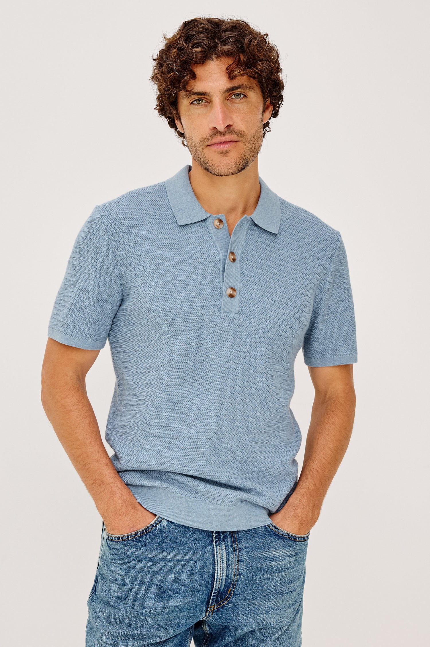 Nathan Polo Shirt in Cotton Blend Knit With Collar, Quarter Button Placket, and Short Sleeves in Blue Sky Heather Colorway - Upper Body Front View Featured on Model