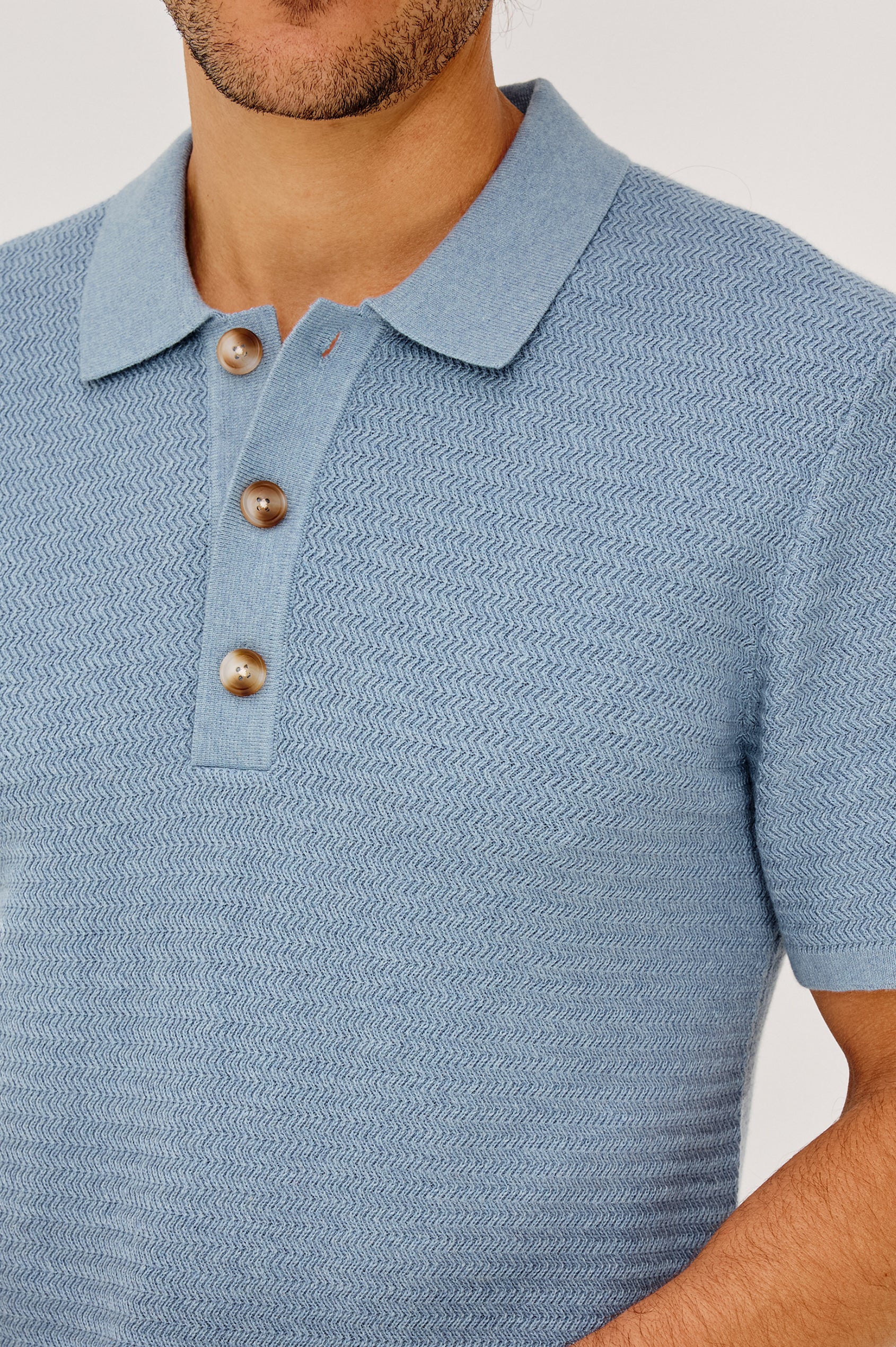 Nathan Polo Shirt in Cotton Blend Knit With Collar, Quarter Button Placket, and Short Sleeves in Blue Sky Heather Colorway - Upper Body Front View Featured on Model