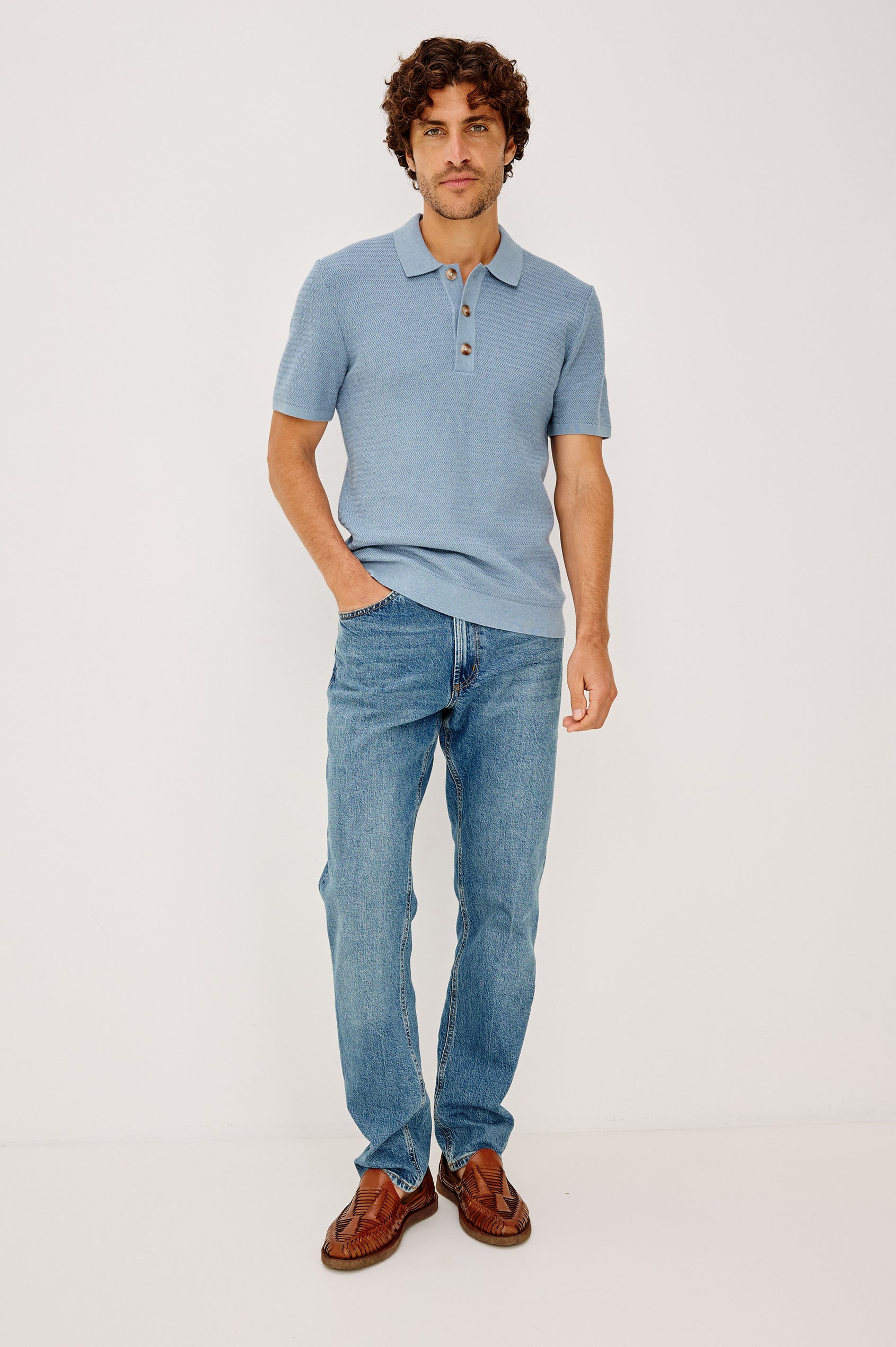 Nathan Polo Shirt in Cotton Blend Knit With Collar, Quarter Button Placket, and Short Sleeves in Blue Sky Heather Colorway - Full Body Front View Featured on Model