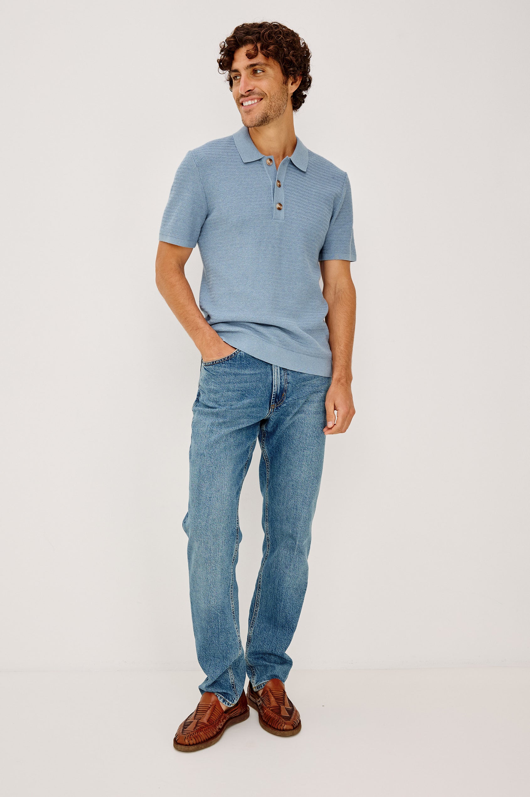 Nathan Polo Shirt in Cotton Blend Knit With Collar, Quarter Button Placket, and Short Sleeves in Blue Sky Heather Colorway - Full Body Front View Featured on Model