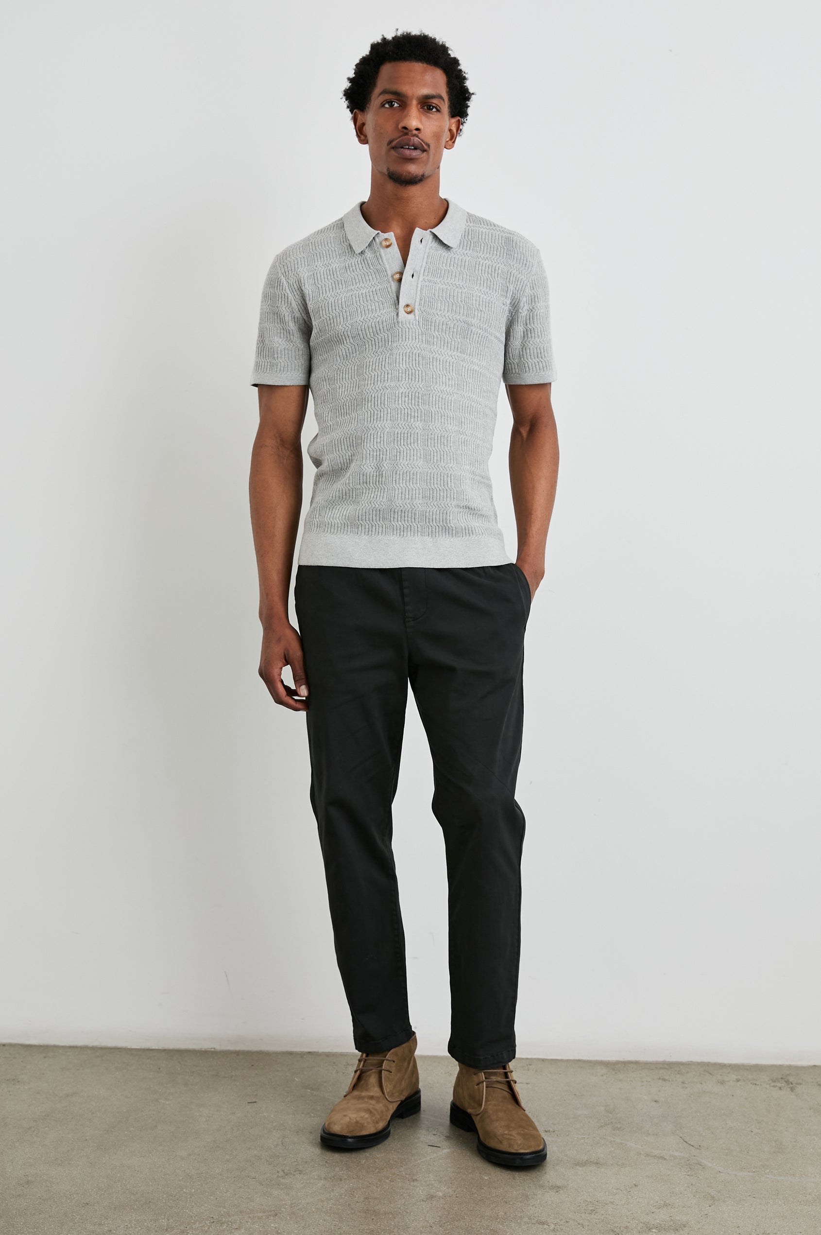 Nathan Short-Sleeve Polo Shirt with a Three-Button Placket and a Jacquard Pattern in Concrete Melange Colorway - Front Full Body View Featured on Model