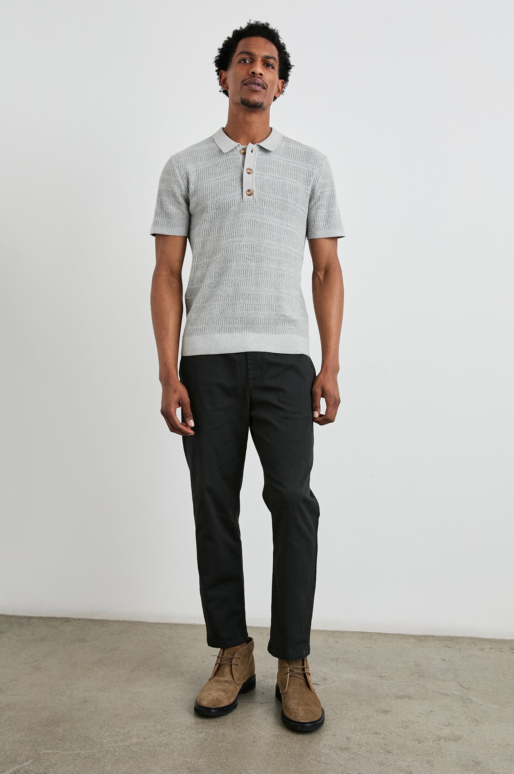 Nathan Short-Sleeve Polo Shirt with a Three-Button Placket and a Jacquard Pattern in Concrete Melange Colorway - Front Full Body View Featured on Model