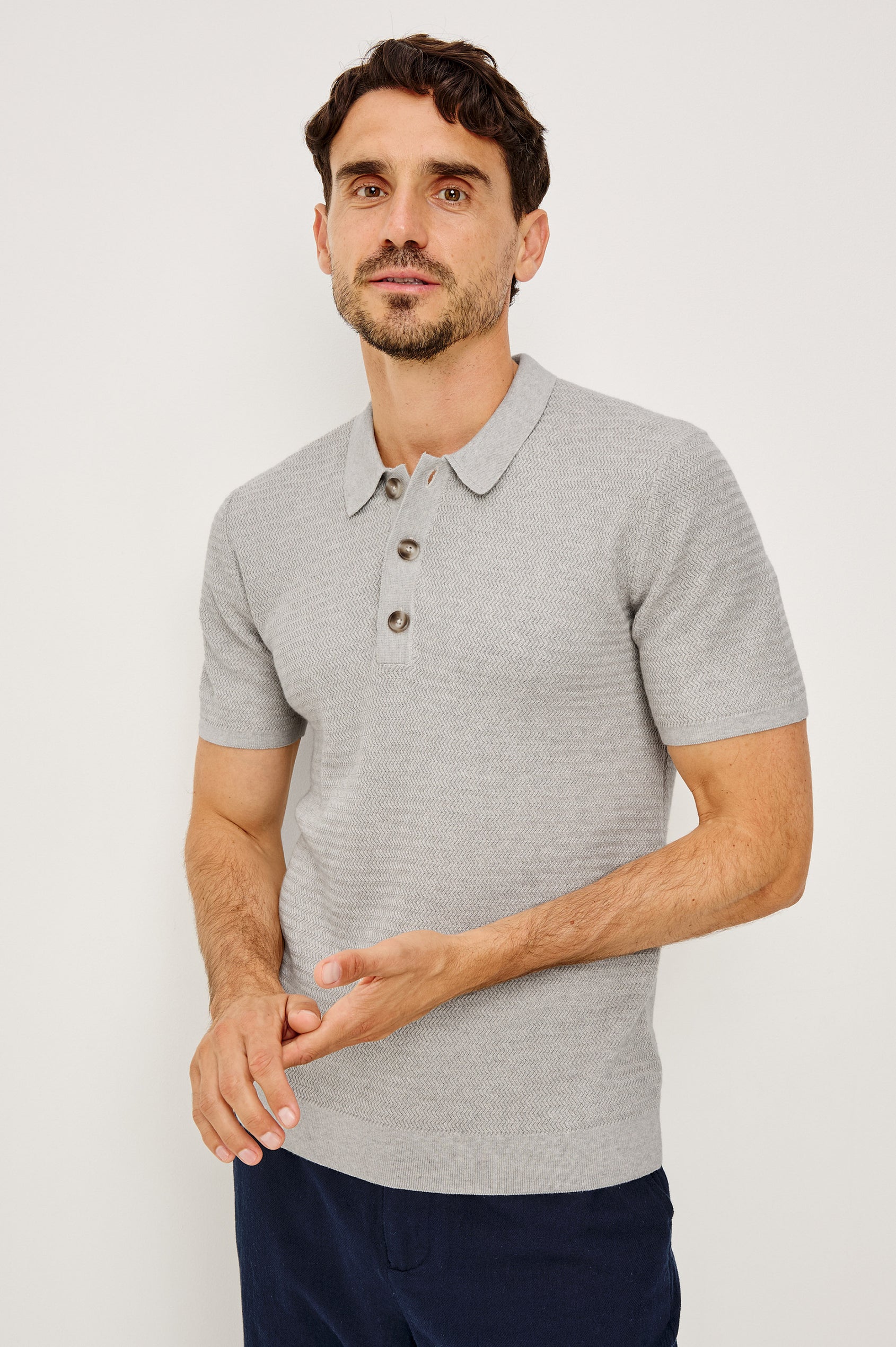 Nathan Polo Shirt in Cotton Blend Knit With Collar, Quarter Button Placket, and Short Sleeves in Heather Grey Colorway - Upper Body Front View Featured on Model
