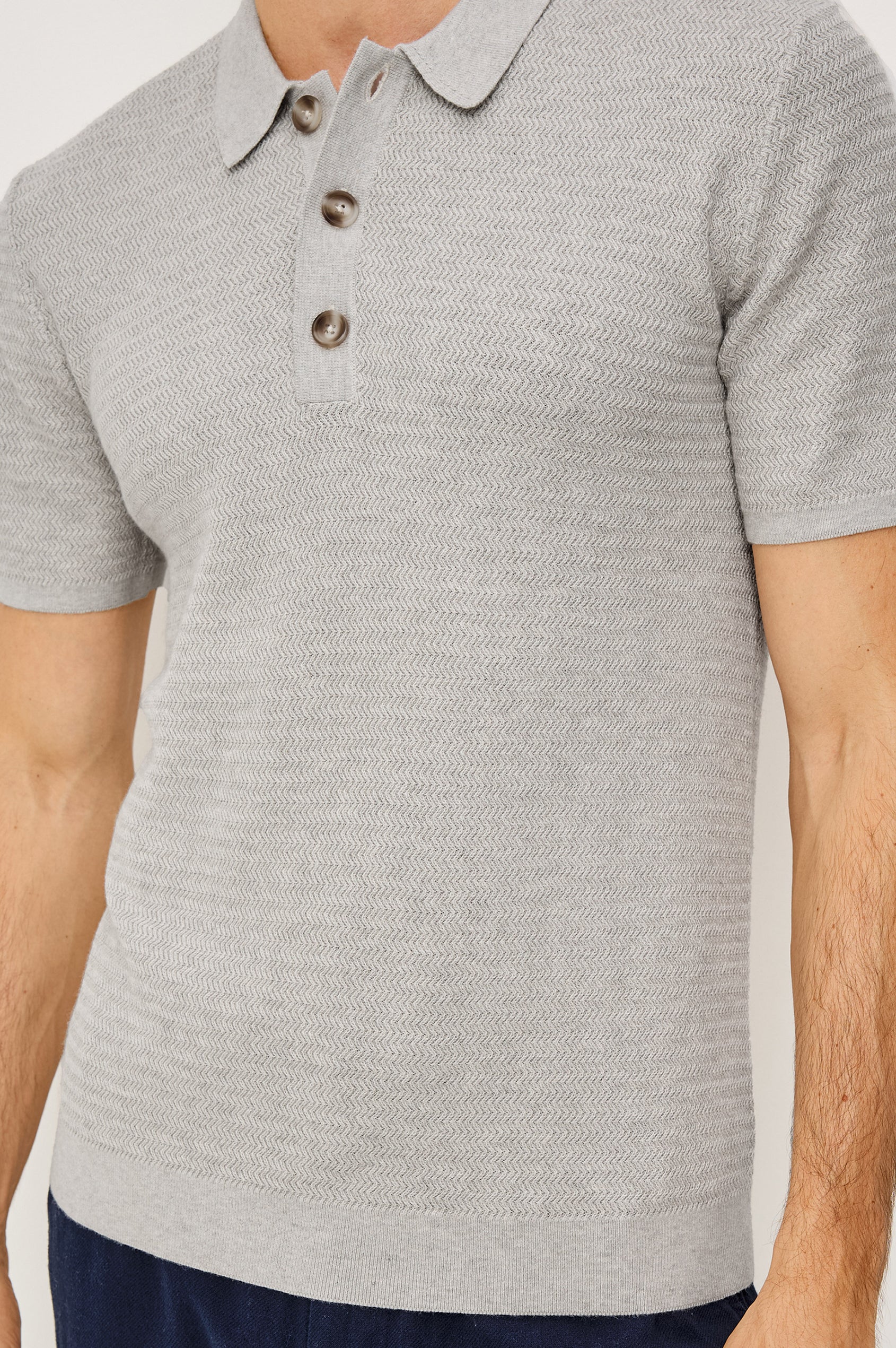 Nathan Polo Shirt in Cotton Blend Knit With Collar, Quarter Button Placket, and Short Sleeves in Heather Grey Colorway - Upper Body Front View Featured on Model