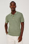 Nathan Polo Shirt in Cotton Blend Knit With Collar, Quarter Button Placket, and Short Sleeves in Silver Sage Colorway - Upper Body Front View Featured on Model