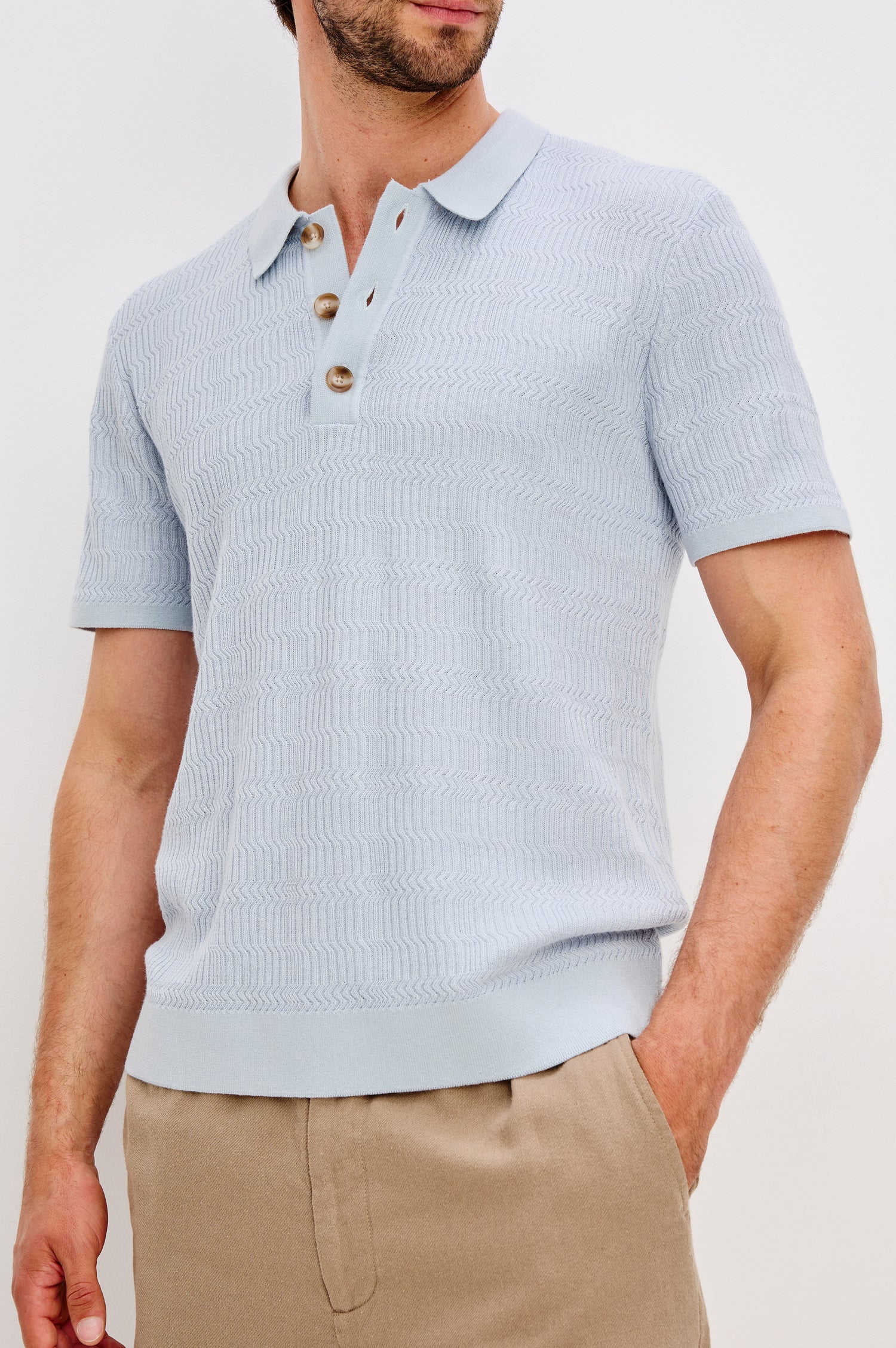 Nathan Short-Sleeve Polo Shirt with a Three-Button Placket and a Jacquard Pattern in Skyway Colorway - Front Detail View Featured on Model