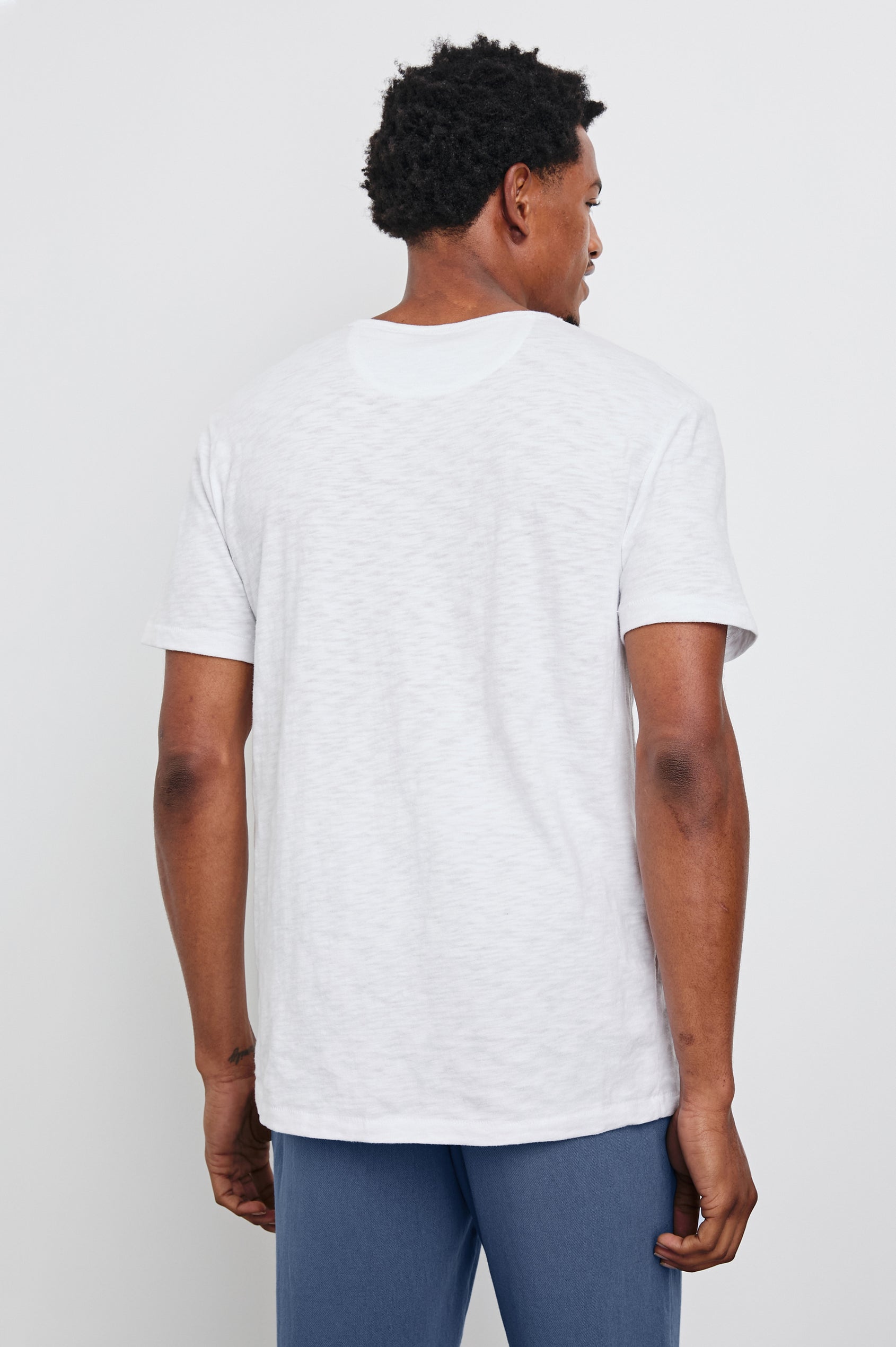 Neil T-Shirt with a Crew Neck in White Colorway - Back View Featured on Model 