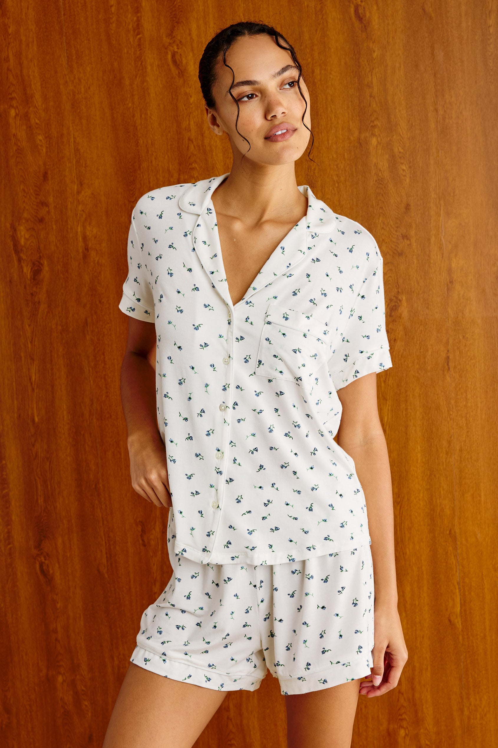 Nessa Pajama Set in Signature Rayon With Relaxed Long-Sleeve Button-Up Shirt WIth Collar, Piping Throughout, and HIgh-Rise Shorts With Elastic Waistband in Blue Buds Colorway - Upper Body Front View Featured on Model