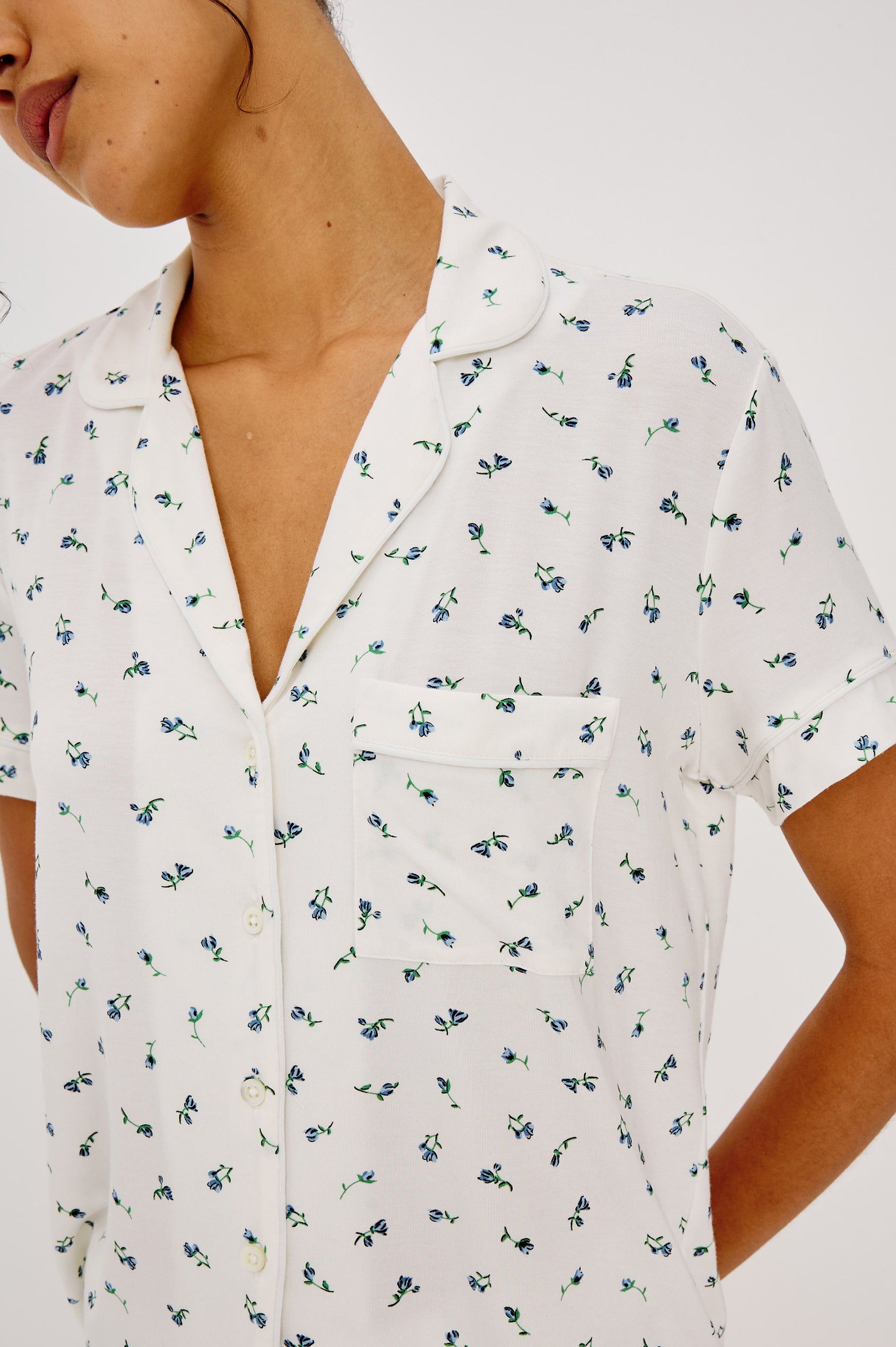 Nessa Pajama Set in Signature Rayon With Relaxed Long-Sleeve Button-Up Shirt WIth Collar, Piping Throughout, and HIgh-Rise Shorts With Elastic Waistband in Blue Buds Colorway - Upper Body Close Up Front View Featured on Model