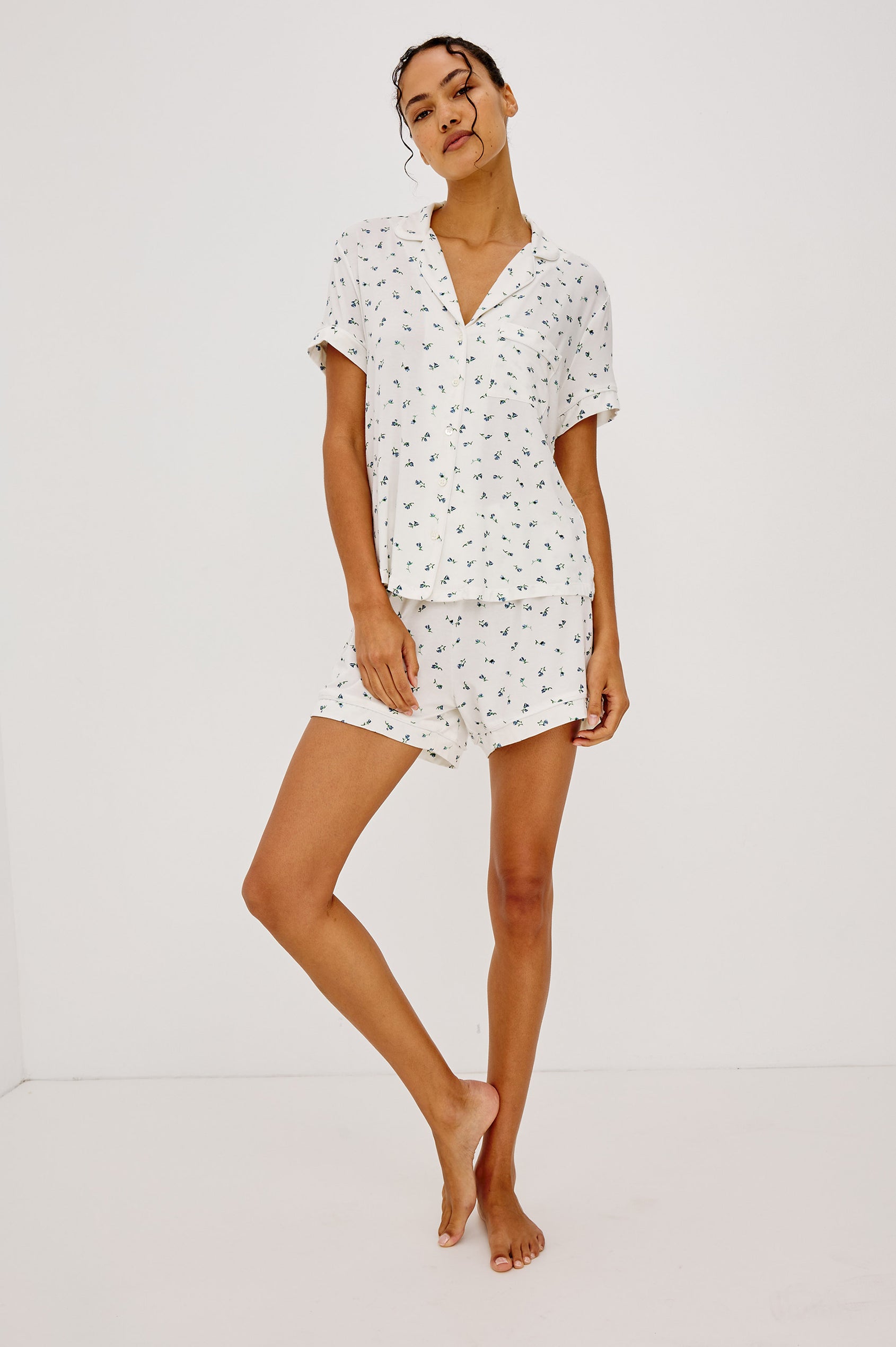 Nessa Pajama Set in Signature Rayon With Relaxed Long-Sleeve Button-Up Shirt WIth Collar, Piping Throughout, and HIgh-Rise Shorts With Elastic Waistband in Blue Buds Colorway - Full Body Front View Featured on Model