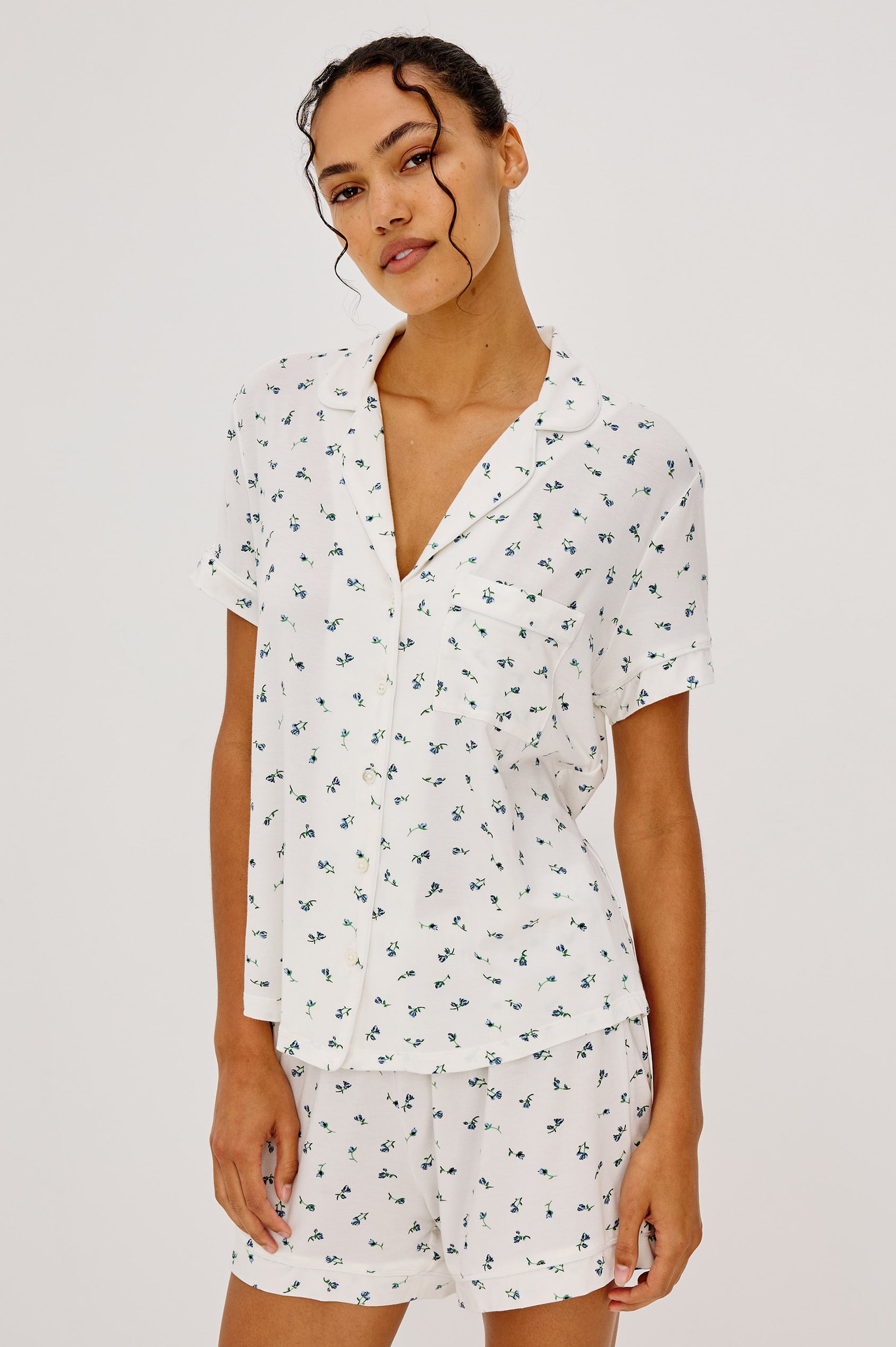 Nessa Pajama Set in Signature Rayon With Relaxed Long-Sleeve Button-Up Shirt WIth Collar, Piping Throughout, and HIgh-Rise Shorts With Elastic Waistband in Blue Buds Colorway - Upper Body Front View Featured on Model
