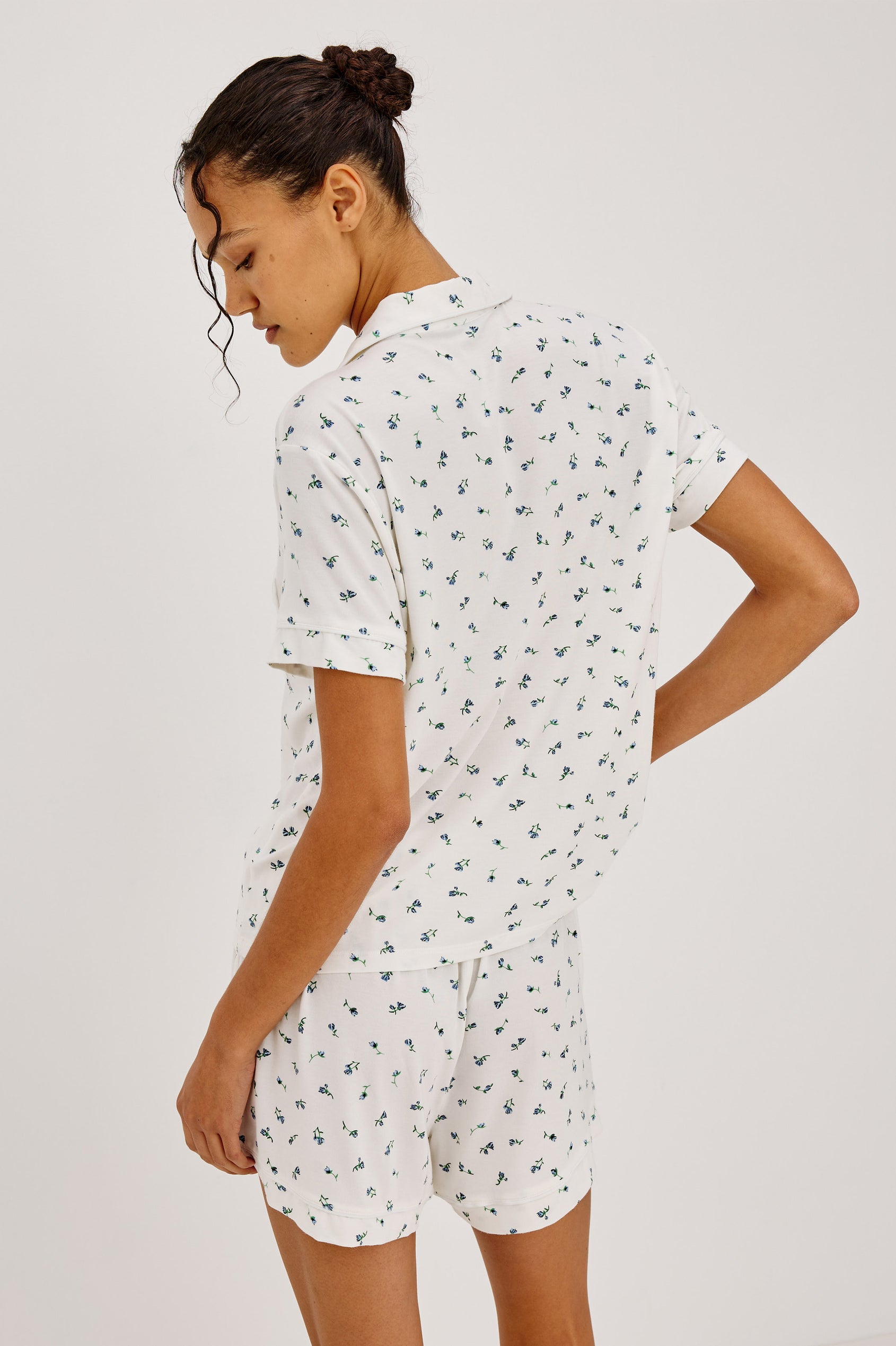 Nessa Pajama Set in Signature Rayon With Relaxed Long-Sleeve Button-Up Shirt WIth Collar, Piping Throughout, and HIgh-Rise Shorts With Elastic Waistband in Blue Buds Colorway - Upper Body Back View Featured on Model