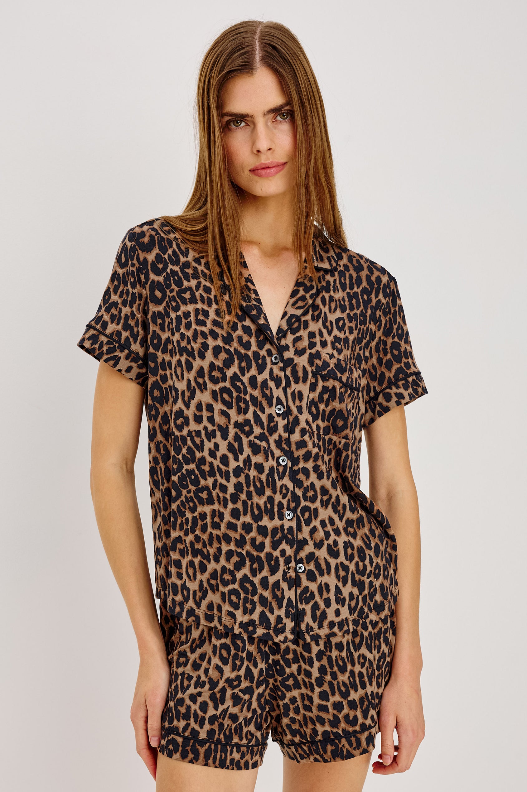 Nessa Pajama Set in Signature Rayon With Relaxed Long-Sleeve Button-Up Shirt WIth Collar, Piping Throughout, and HIgh-Rise Shorts With Elastic Waistband in Brown Nala Colorway - Upper Body Front View Featured on Model