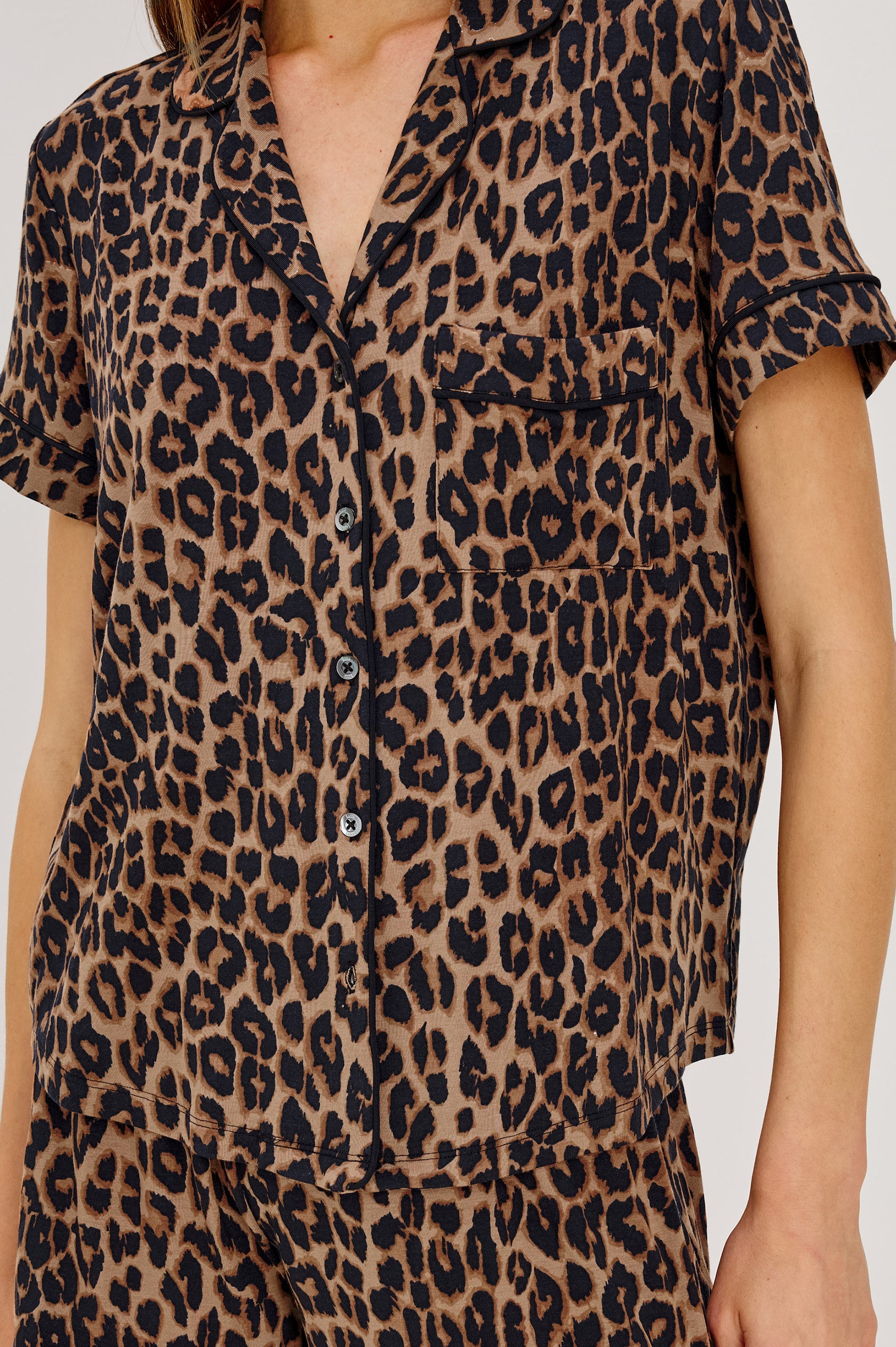 Nessa Pajama Set in Signature Rayon With Relaxed Long-Sleeve Button-Up Shirt WIth Collar, Piping Throughout, and HIgh-Rise Shorts With Elastic Waistband in Brown Nala Colorway - Upper Body Front View Featured on Model