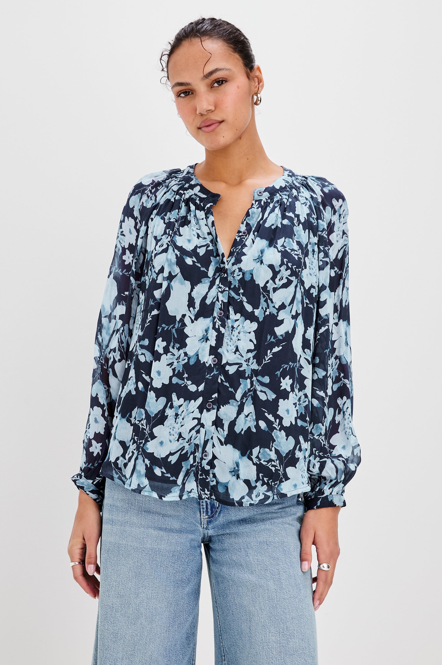 Nessie Long Sleeve Top with Front Button Closure and Ruching along the Neckline in Indigo Blossoms Colorway, Flowers in Blue on Indigo - Front View Featured on Model 