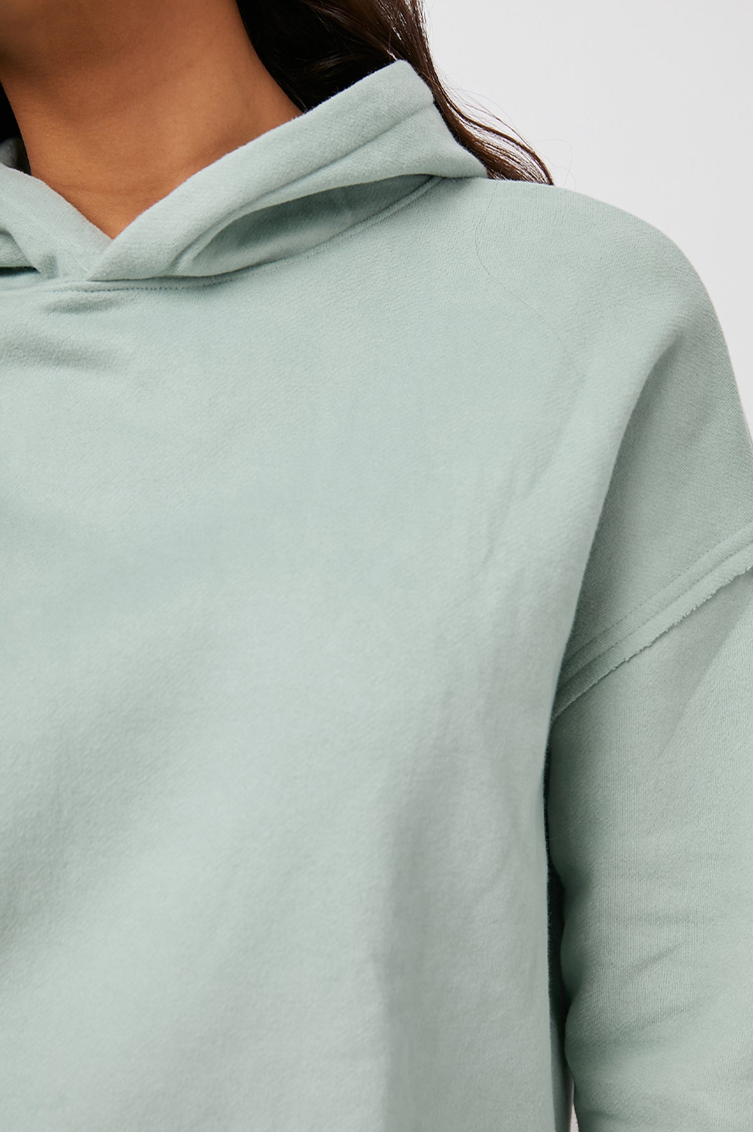 Nico & Edna Set with a Sweatshirt with a Hood and Pants with Two Large Front Pockets and One Back Patch Pocket in Light Seafoam Colorway - Front View Featured on Model 