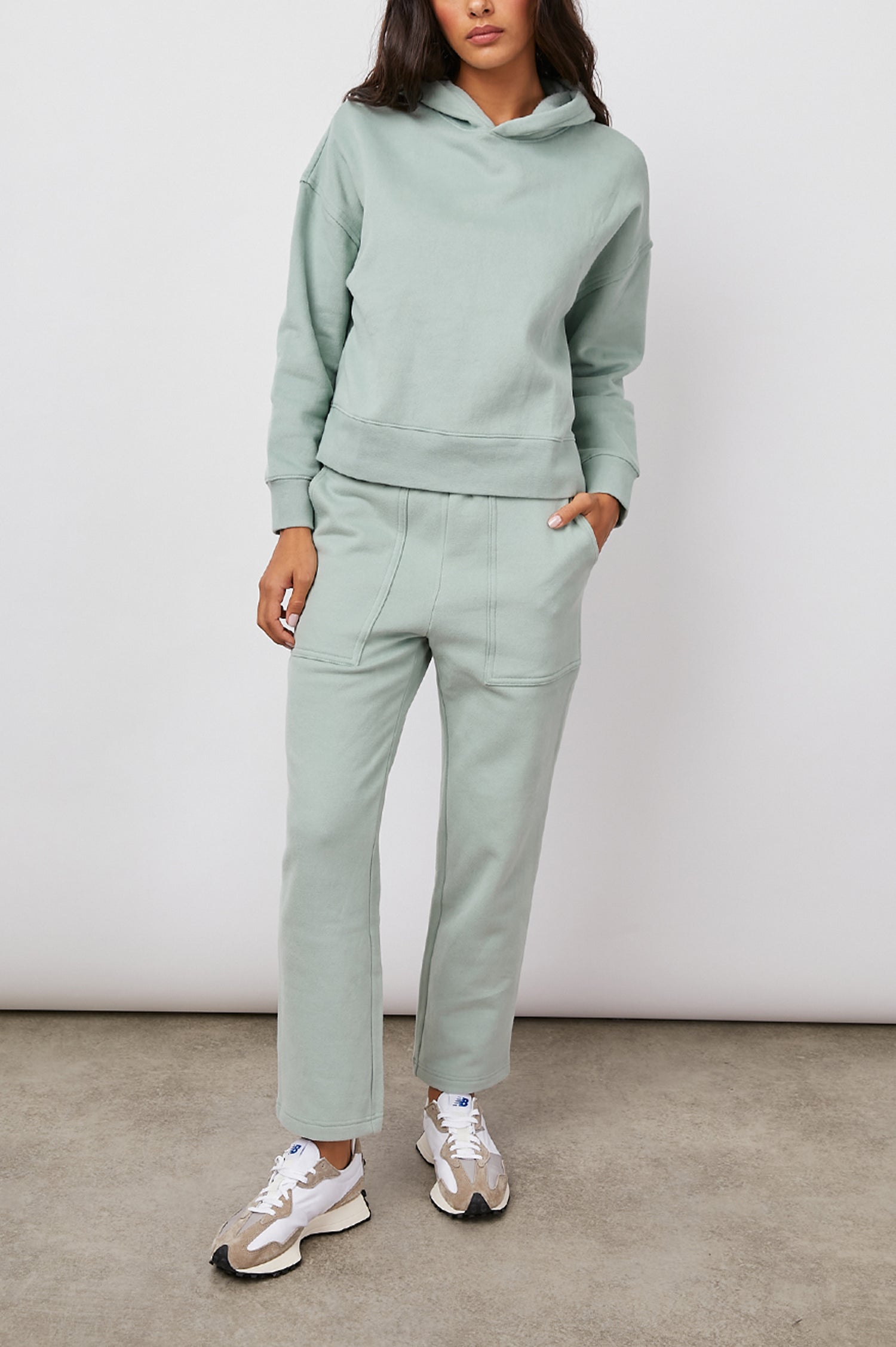 Nico & Edna Set with a Sweatshirt with a Hood and Pants with Two Large Front Pockets and One Back Patch Pocket in Light Seafoam Colorway - Front Full Body View Featured on Model 