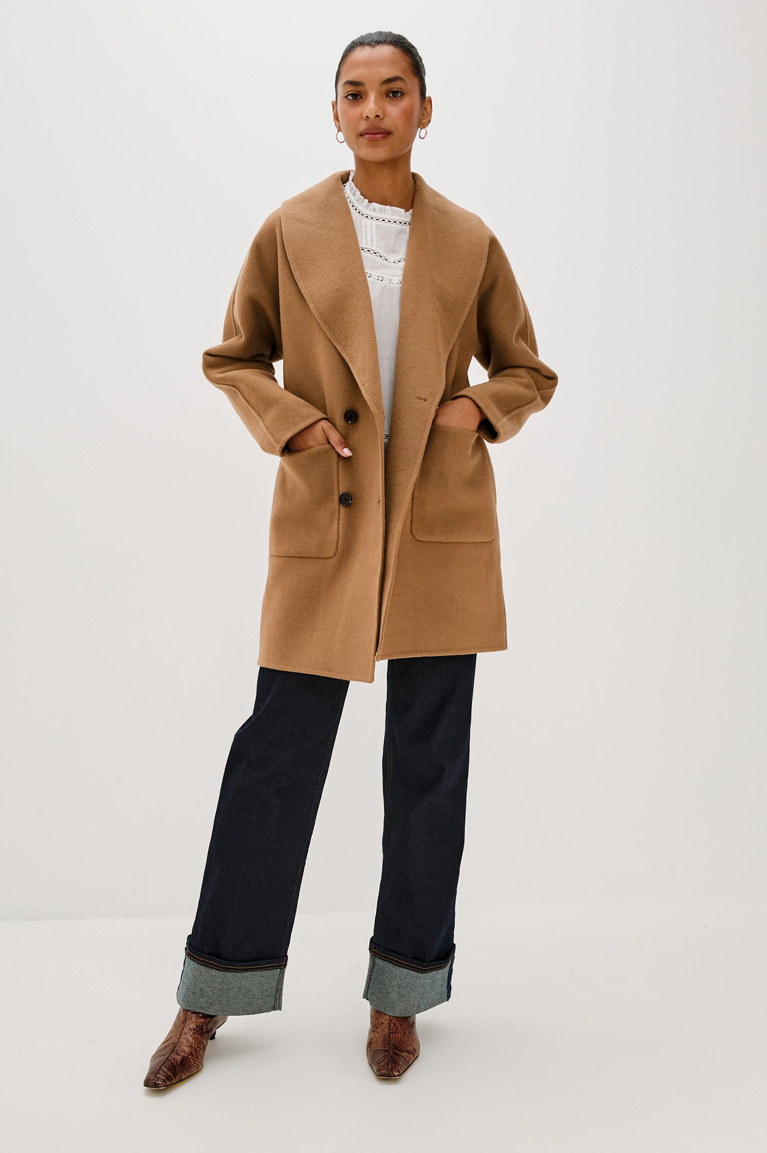 Nily Mid-Thigh Length, Double-Breasted Coat with Two Button Closure, Two Front Patch Pockets and a Shaw Collar in Camel Colorway - Full Body Front View Featured on Model 